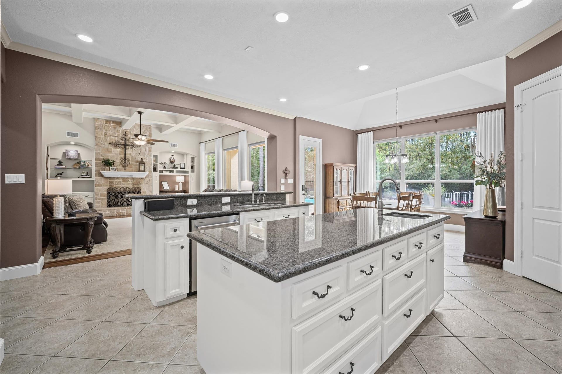 25815 Bridle Creek Drive S, Magnolia, TX 77355 Spacious island kitchen opening to the formal dining and living areas