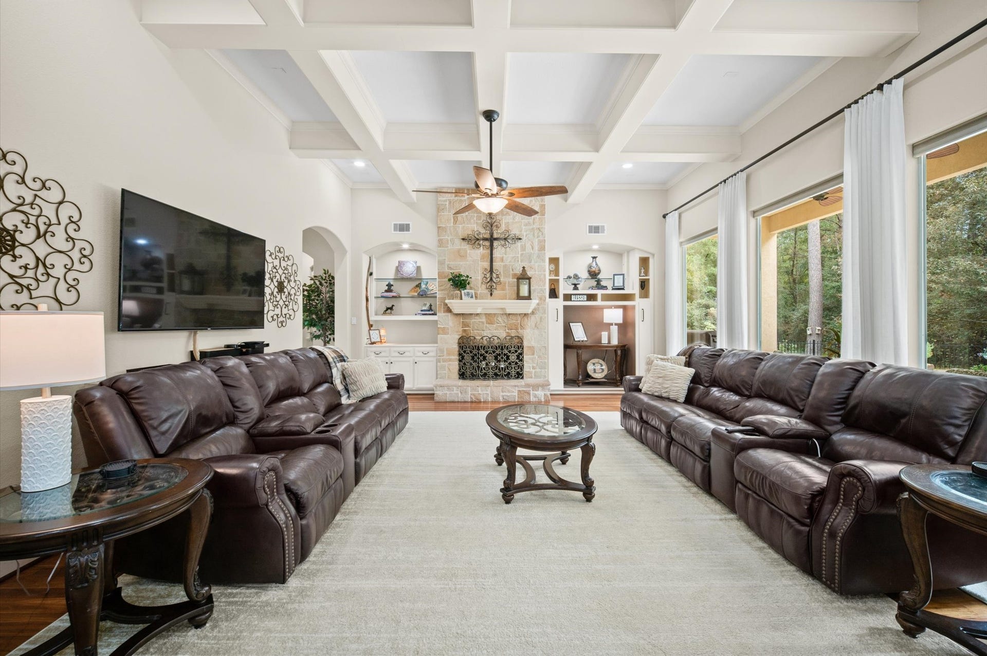 25815 Bridle Creek Drive S, Magnolia, TX 77355 Spacious family room with abundant natural light and views of the private backyard