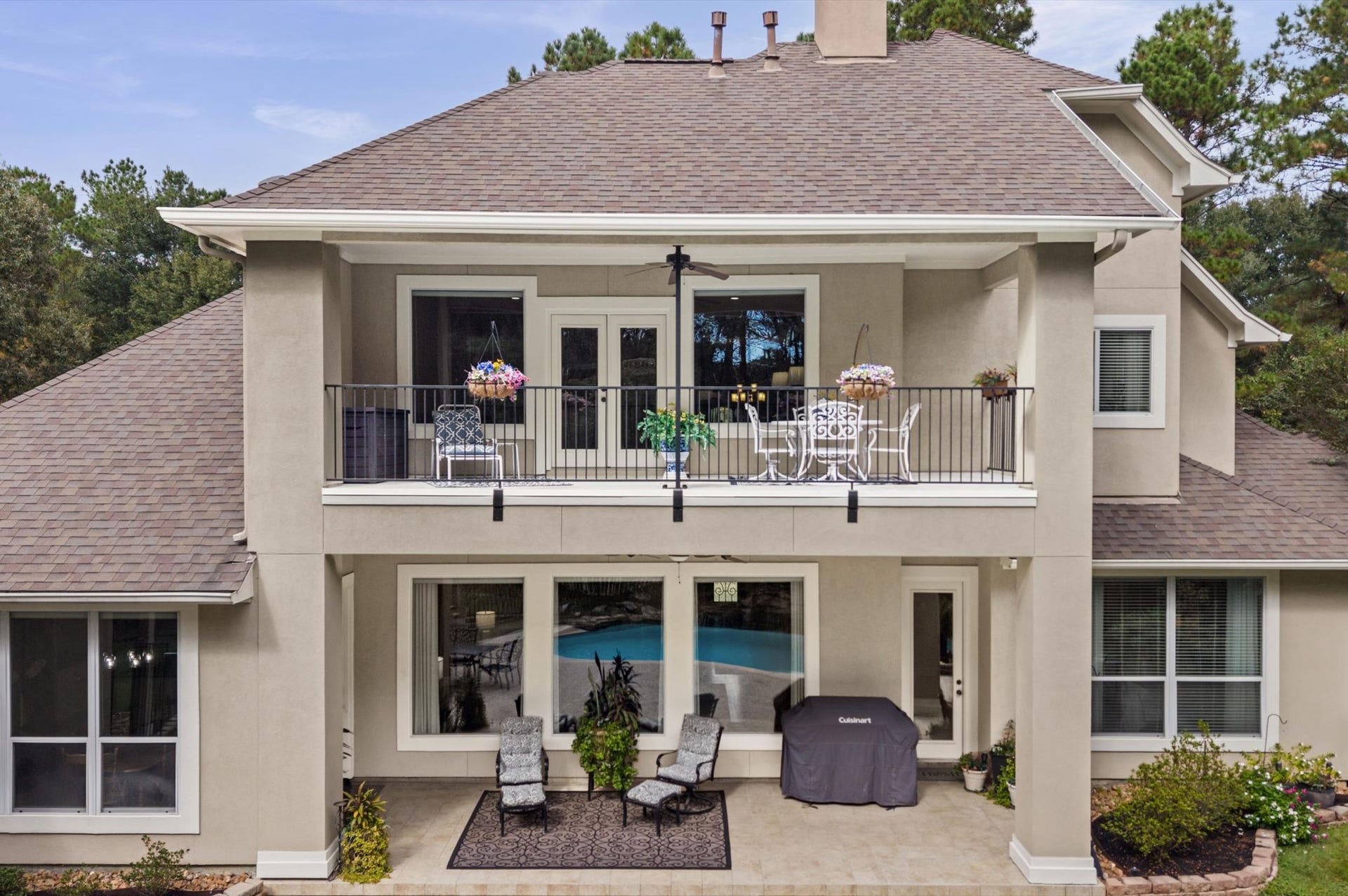 25815 Bridle Creek Drive S, Magnolia, TX 77355 Rear elevation featuring two levels of covered outdoor living