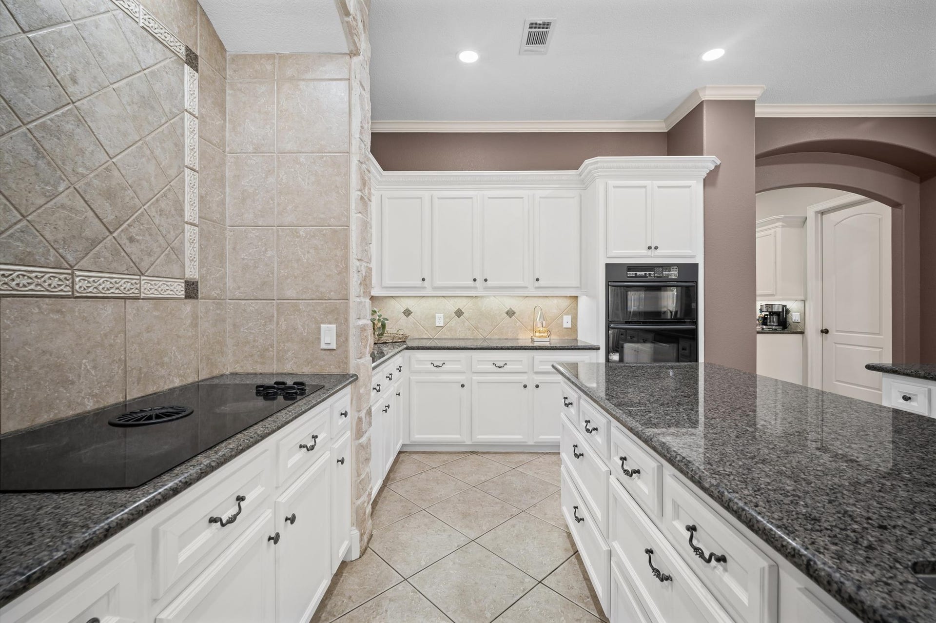 25815 Bridle Creek Drive S, Magnolia, TX 77355 Additional view of the kitchen showcasing the expansive workspace and custom finishes