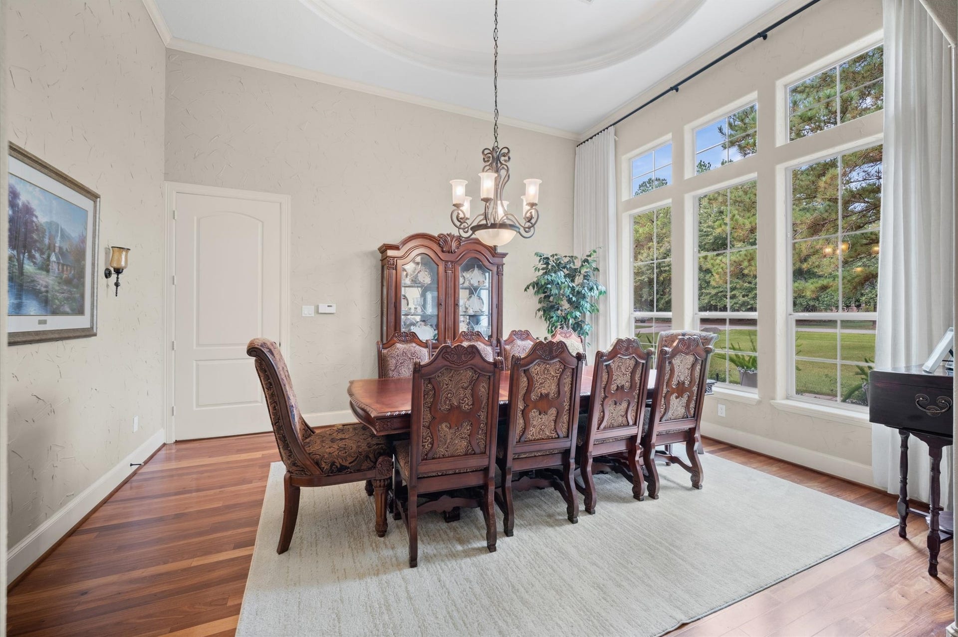 25815 Bridle Creek Drive S, Magnolia, TX 77355 Elegant formal dining room with tile flooring and views of the backyard