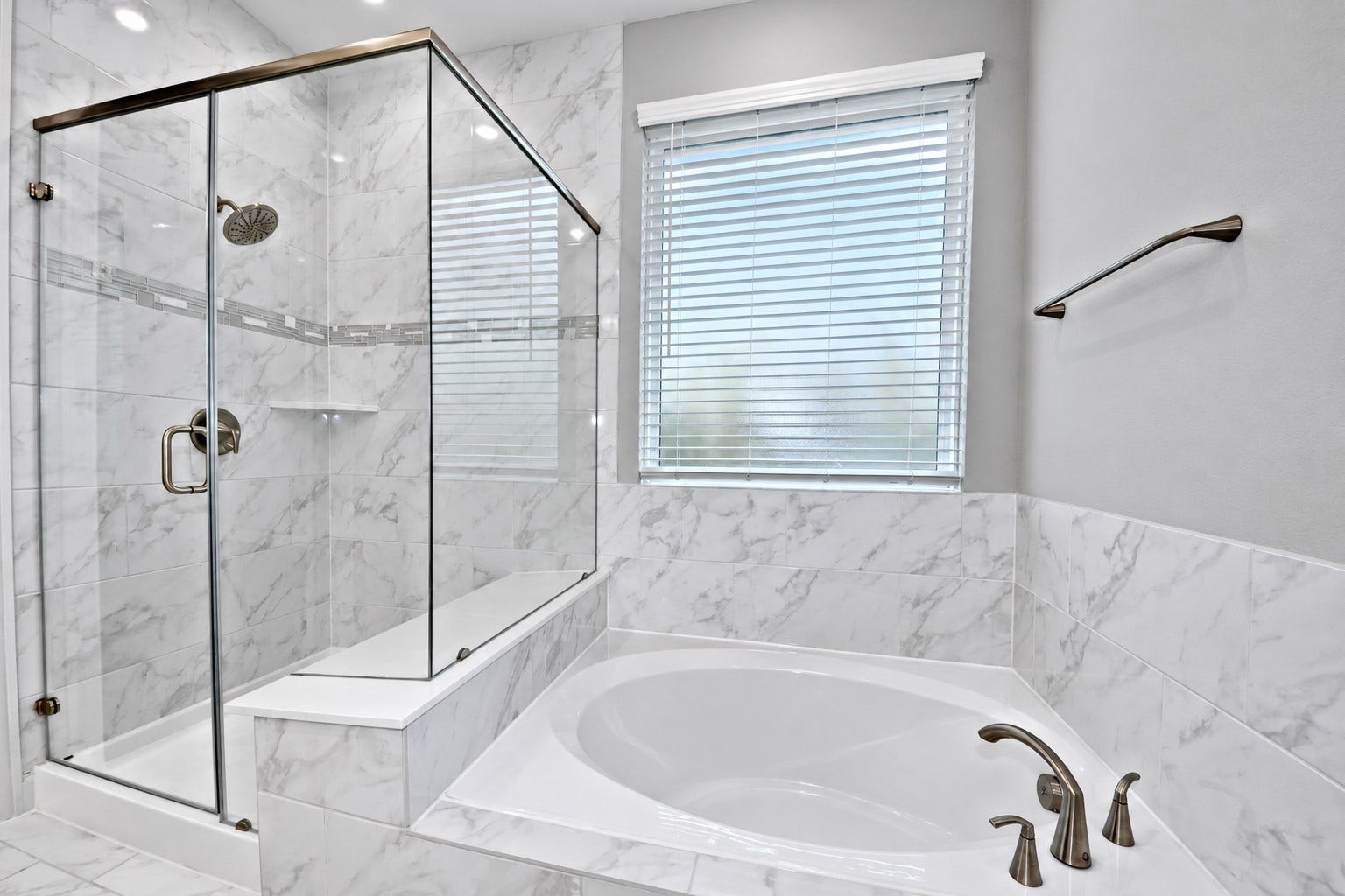 4314 Shaded Arbor Way, Sugar Land, TX 77479 This Primary Suite Bathroom was design for Two! I am a Tub Person and I MUST have a deep Soaker Tub to Melt all that Stress from my day! Beautiful Tile Surroundings, Upgraded Frosted Window that allows that Natural Lighting in! Also included all the Upgraded Hardware and Towel Hangers!