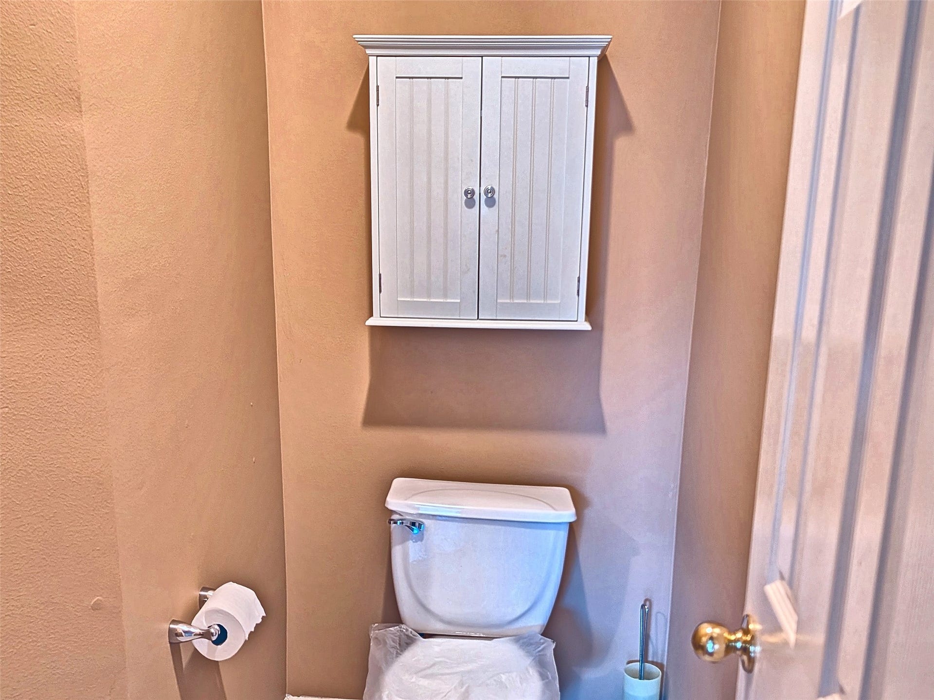 4023 Creek Ridge Lane, Missouri City, TX 77459 Convenient main-floor powder room with storage cabinet.
