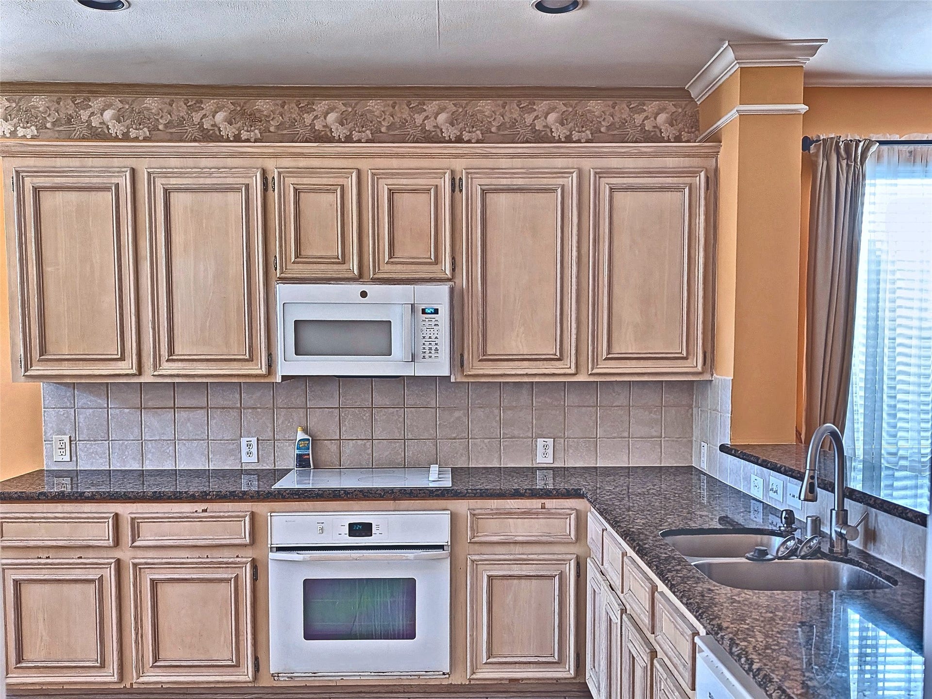 4023 Creek Ridge Lane, Missouri City, TX 77459 Functional kitchen with abundant cabinetry, tile floors, and clean appliances.