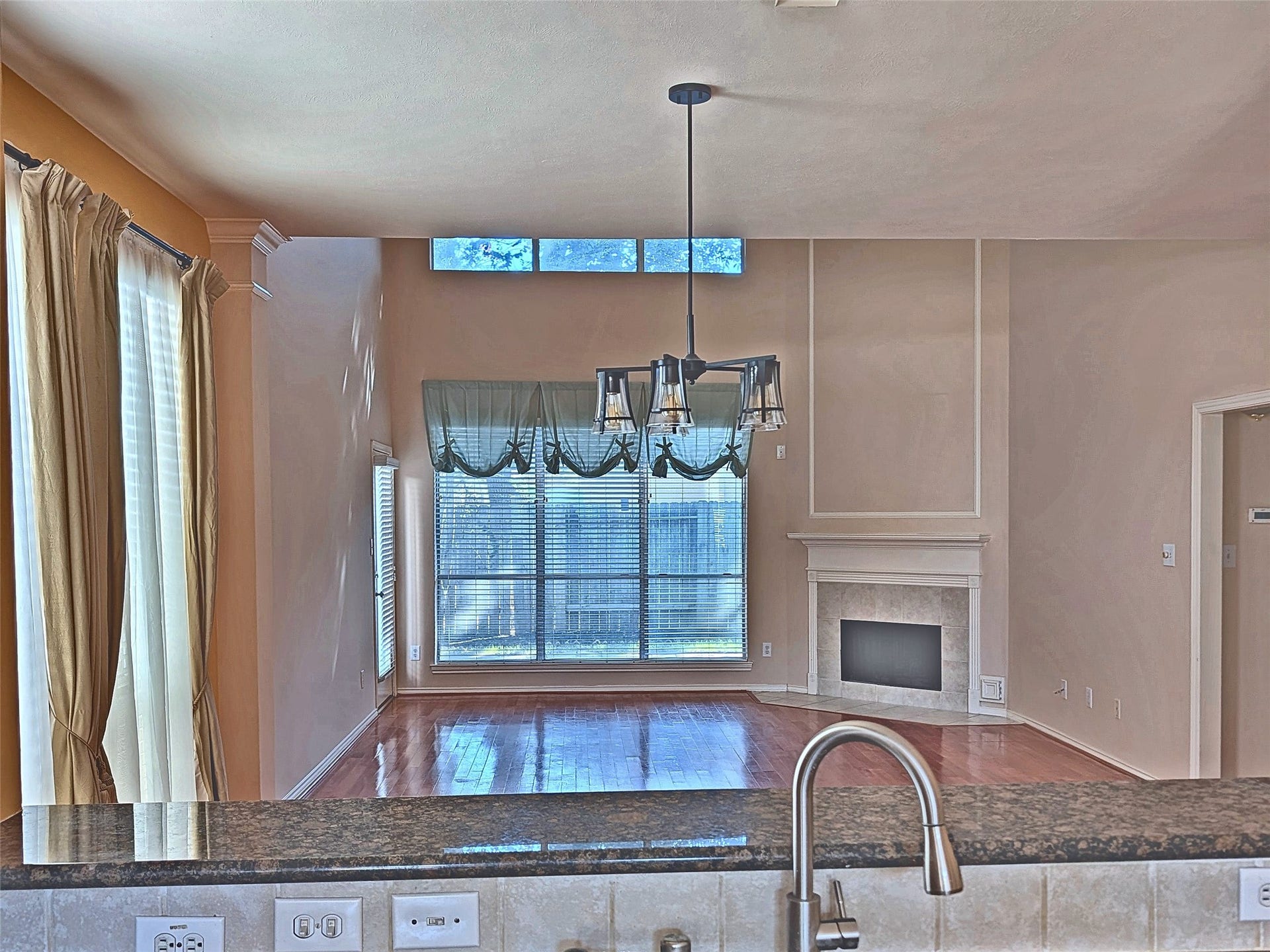4023 Creek Ridge Lane, Missouri City, TX 77459 Open-concept layout connecting kitchen, dining, and family living areas