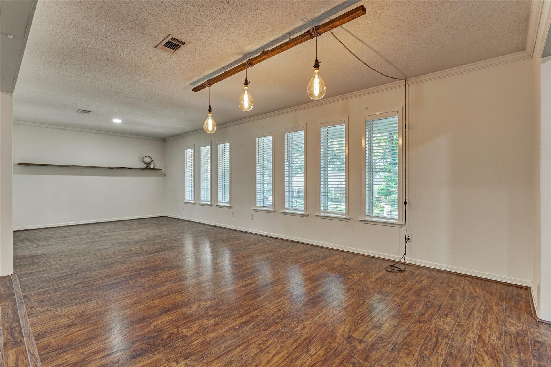 402 Shadywood Circle, Conroe, TX 77304 A beautiful wall of windows fills the space with natural light.