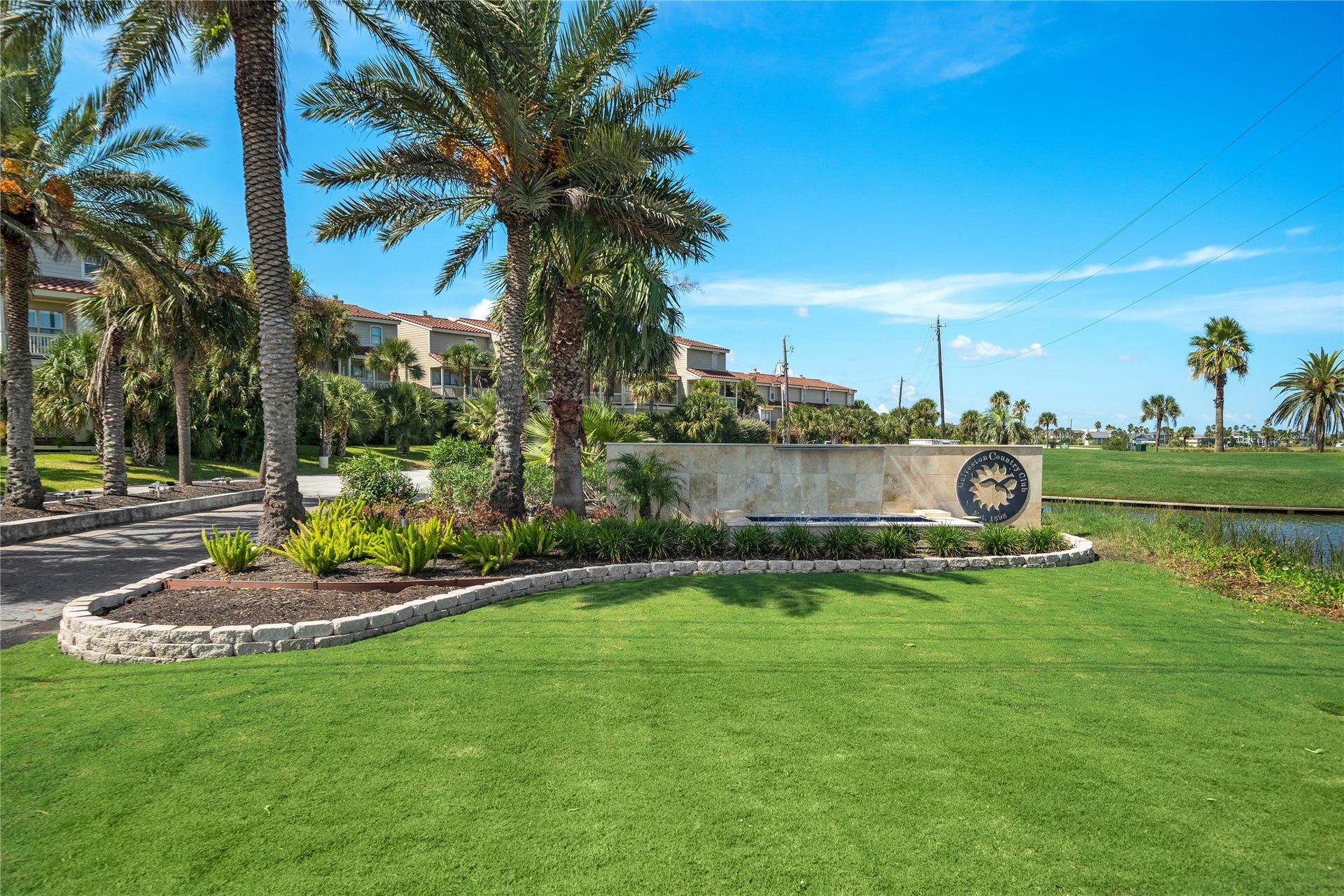 The entrance to the Galveston Country Club, is just a short golf cart ride down the street.
