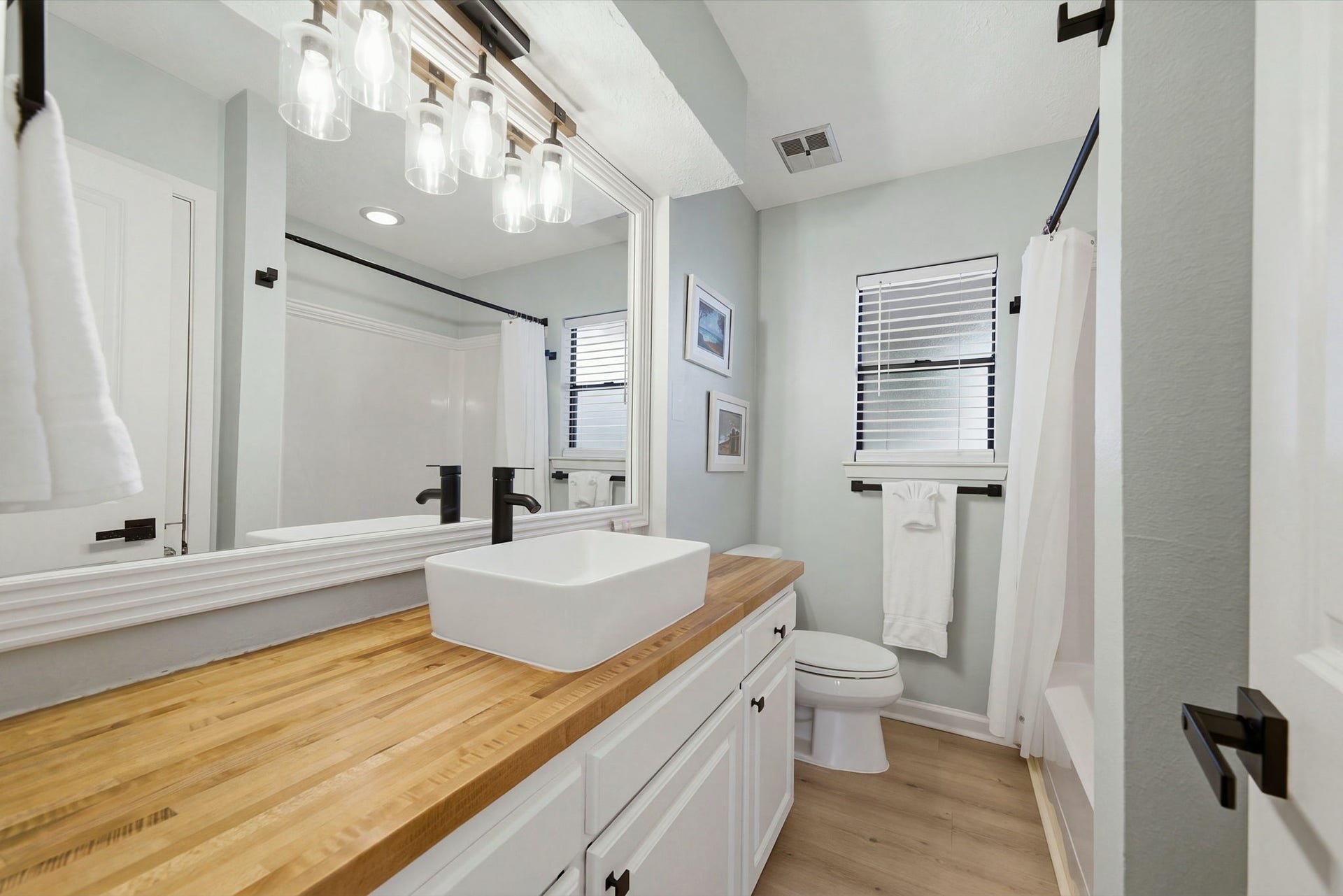 Third of THREE full bathrooms with GORGEOUS remodel. Plus an extra half bath on ground level!