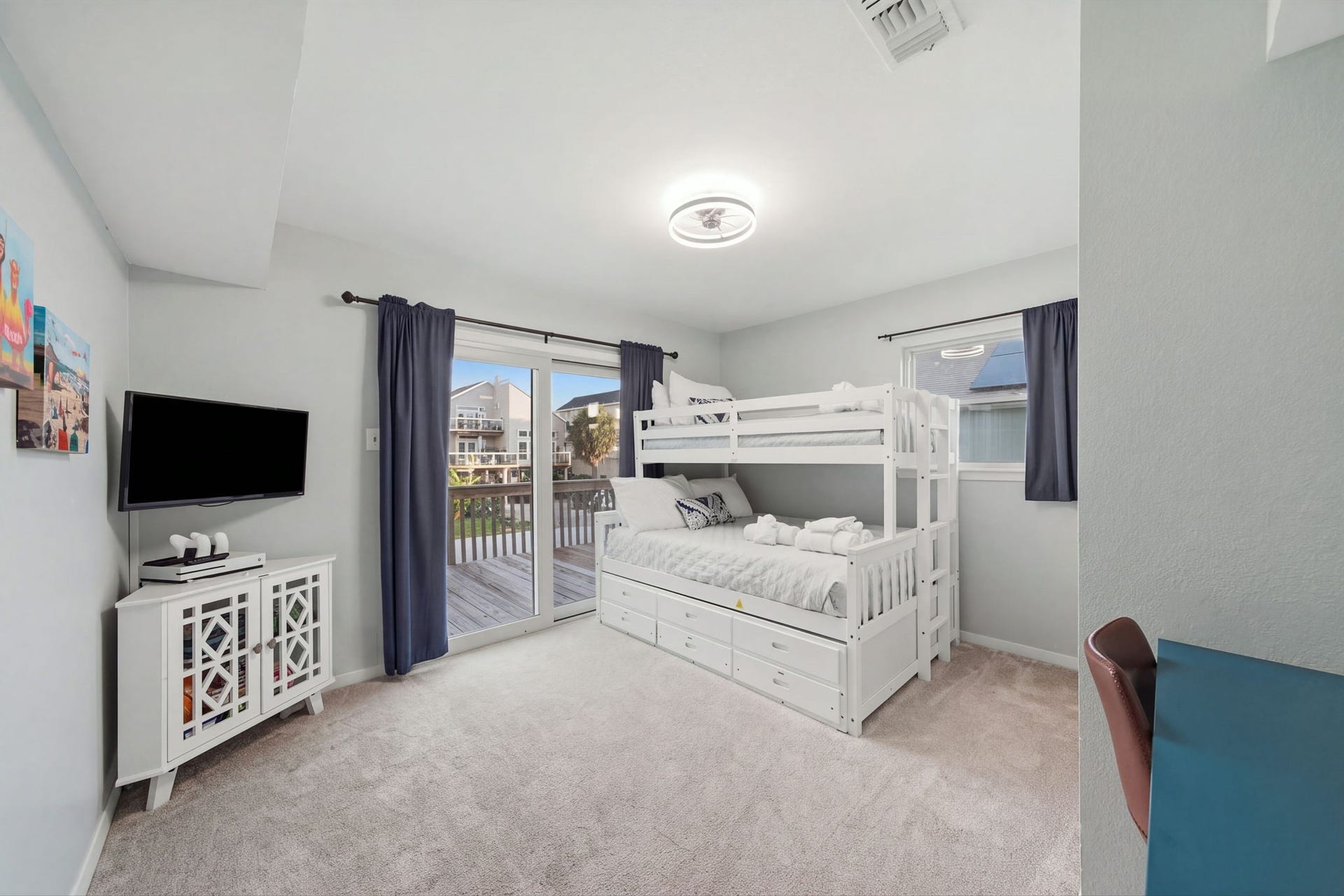 3rd bedroom with built-in bunks, desk area & gaming area.