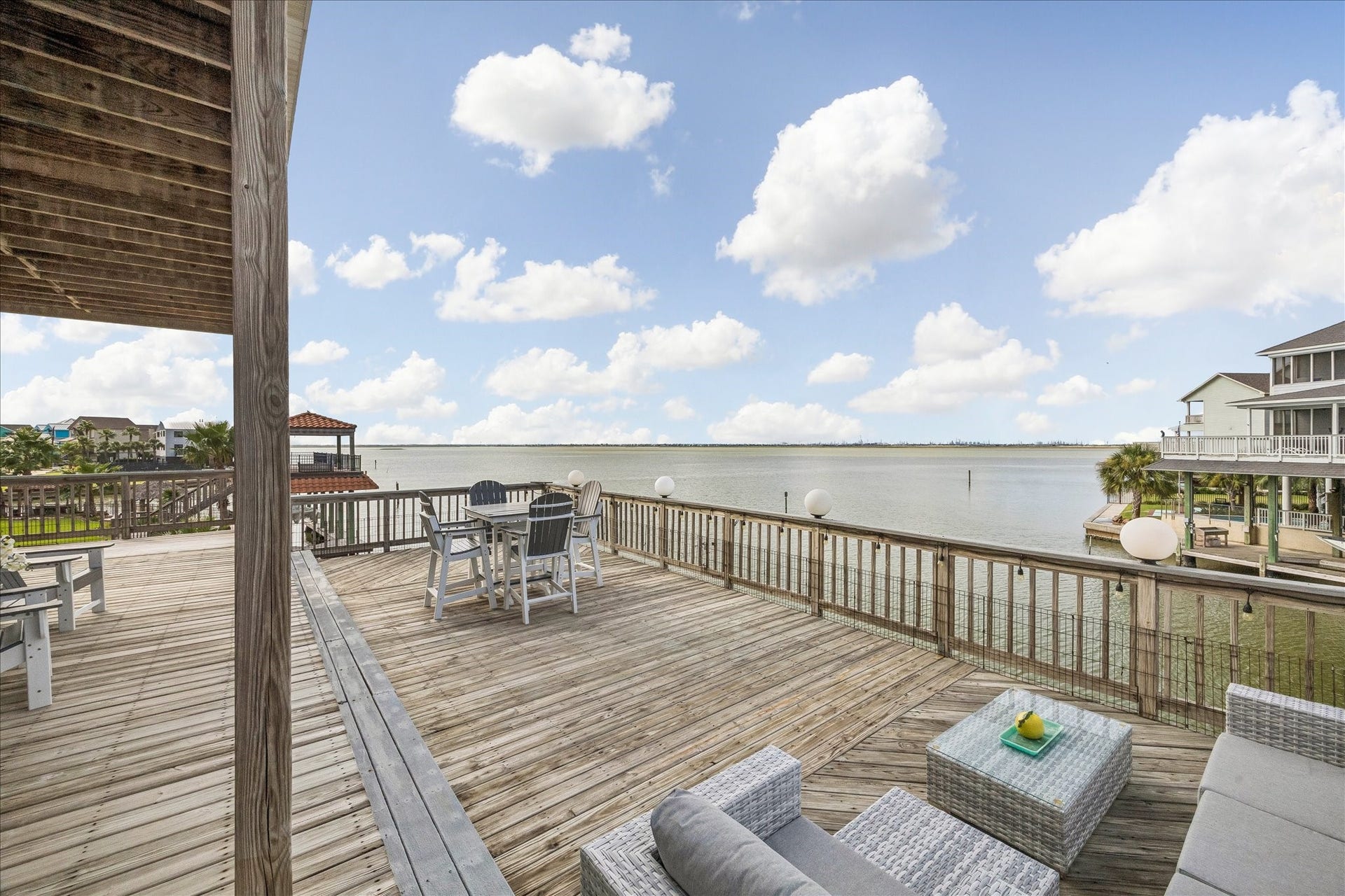 426 Sunset Circle, Tiki Island, TX 77554 Enjoy incredible Bay views from the generous second-level balcony, offering plenty of room for outdoor furnishings.