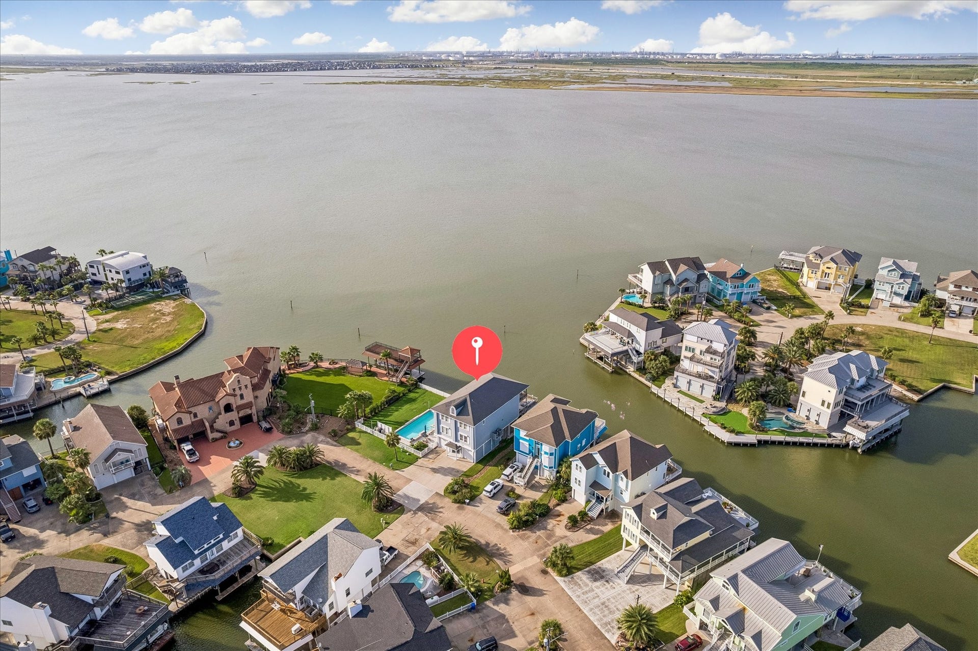 426 Sunset Circle, Tiki Island, TX 77554 Bayfront overlooking Jones Bay, ample room between neighbors.