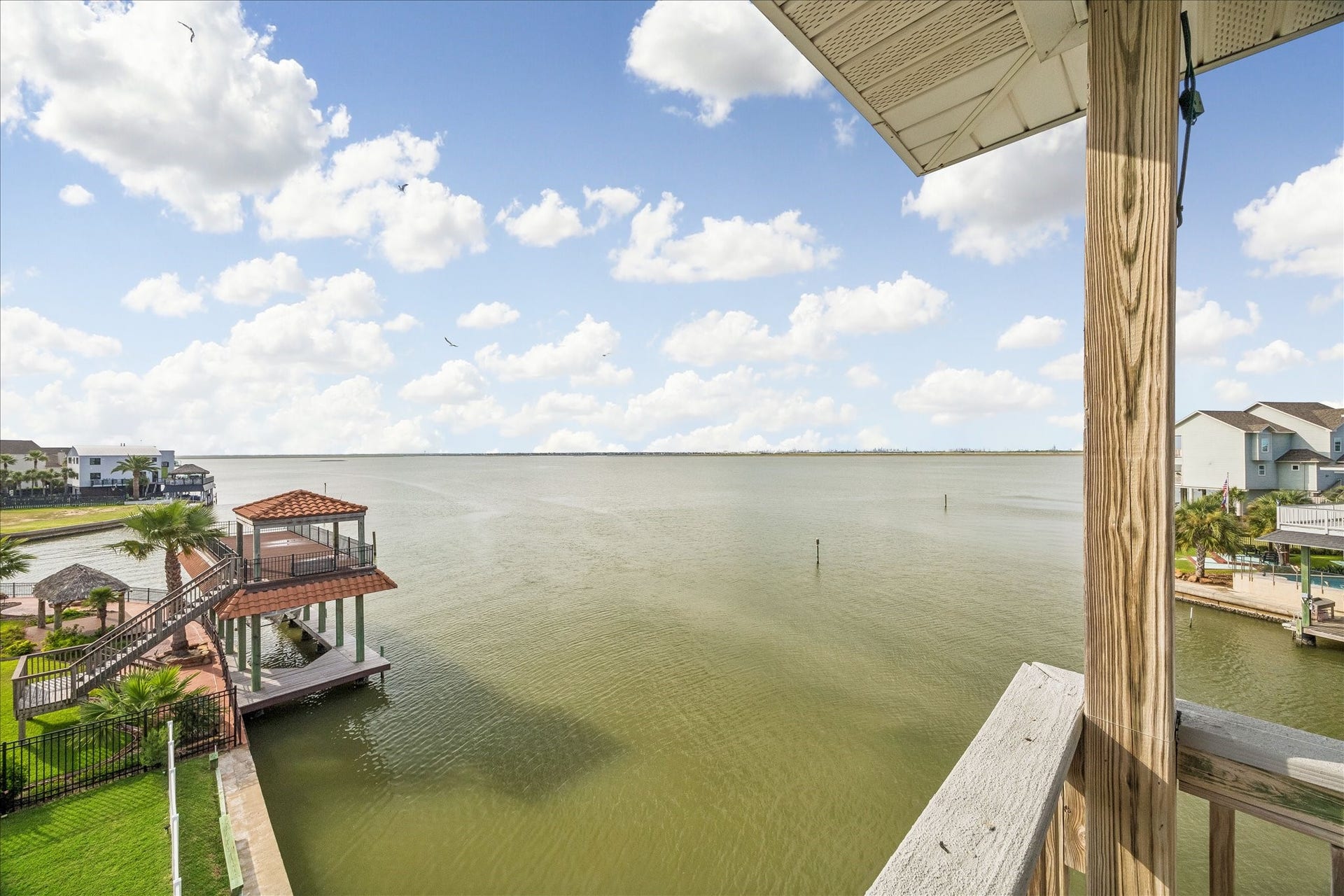 426 Sunset Circle, Tiki Island, TX 77554 Enjoy sweeping Bay views from the third-level balcony, offering a relaxing outdoor retreat for unwinding, enjoying the coastal breeze, and taking in stunning waterfront sunsets. Look at those wide open views!