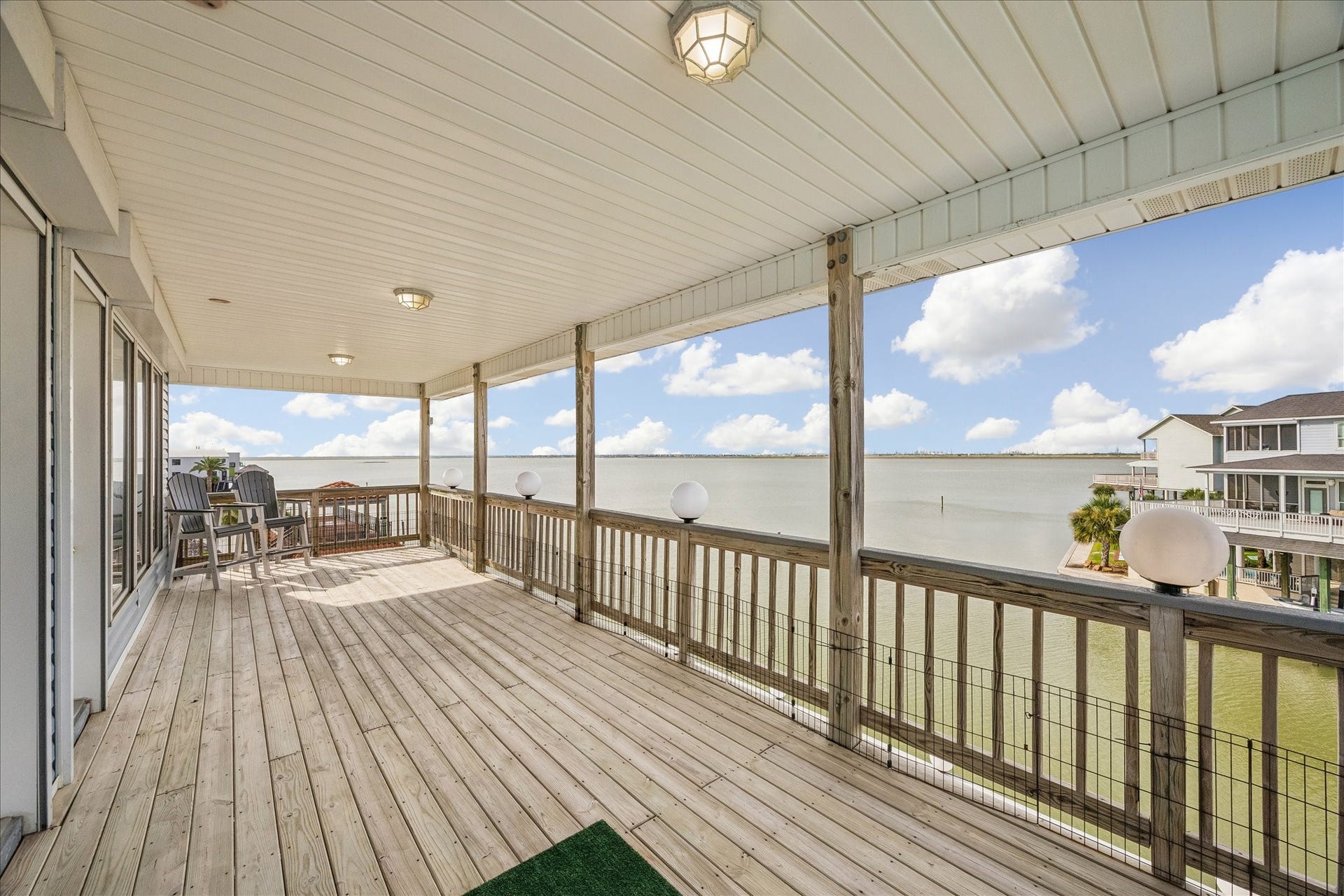426 Sunset Circle, Tiki Island, TX 77554 Large third-level balcony overlooking the Bay, offering plenty of room for outdoor furnishings, dining, and entertaining. Both primary suites provide direct access to this impressive waterfront outdoor space.