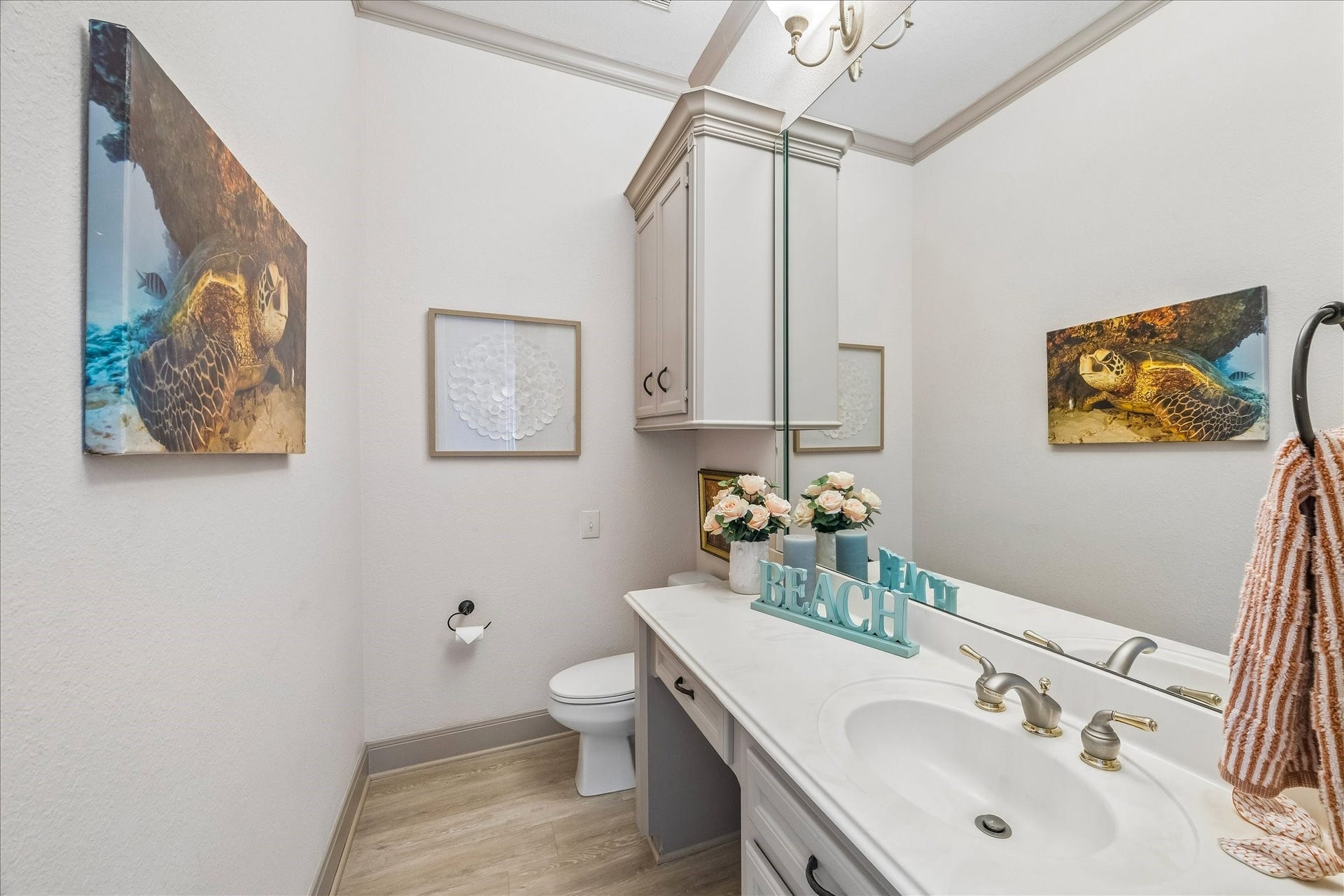 426 Sunset Circle, Tiki Island, TX 77554 A convenient half bath is located just off the kitchen, living area & elevator.