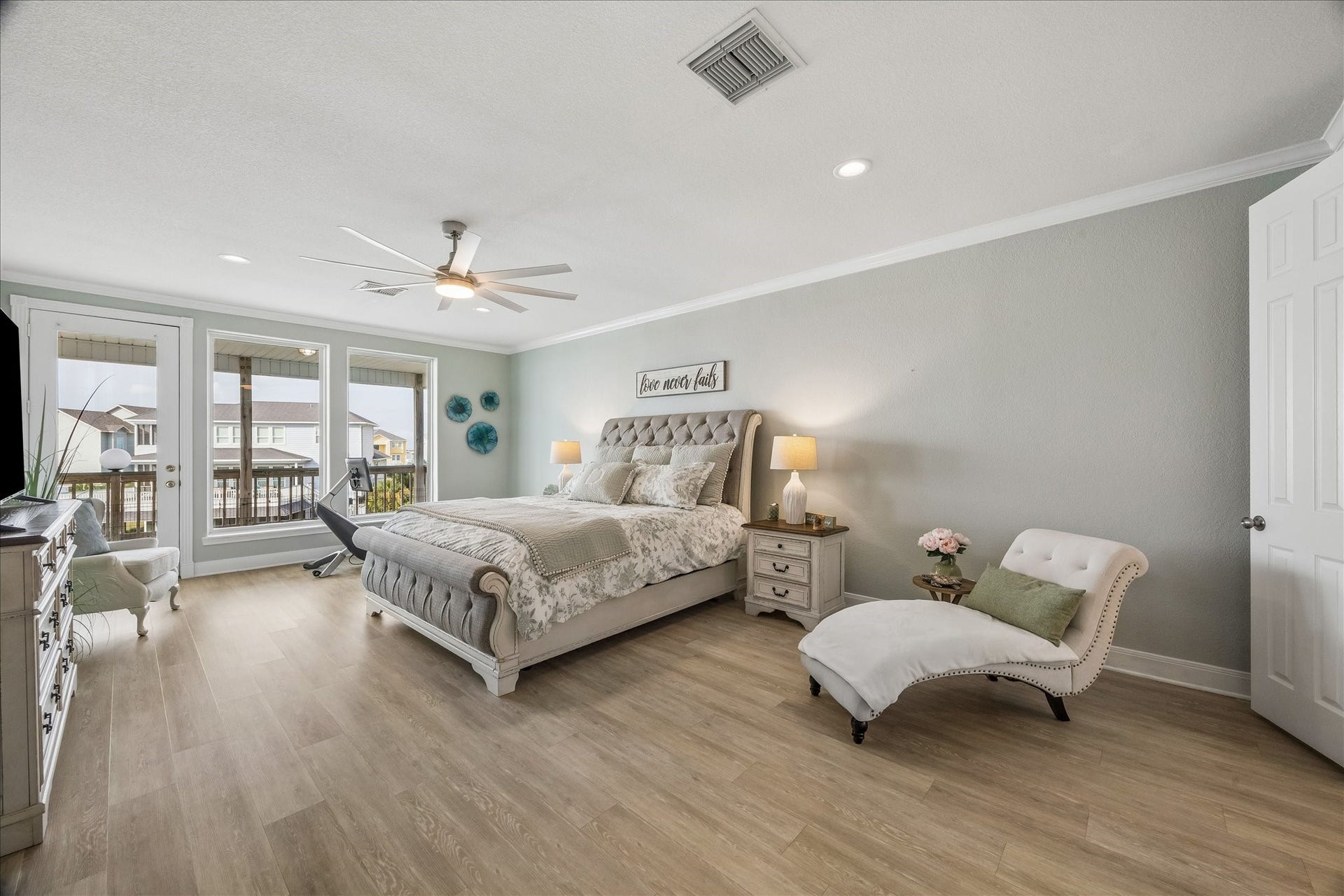 426 Sunset Circle, Tiki Island, TX 77554 On the 3rd level you will find the first primary suite, featuring vinyl wood look flooring, private balcony access overlooking Jones Bay, and dual primary closets...An incredible retreat!