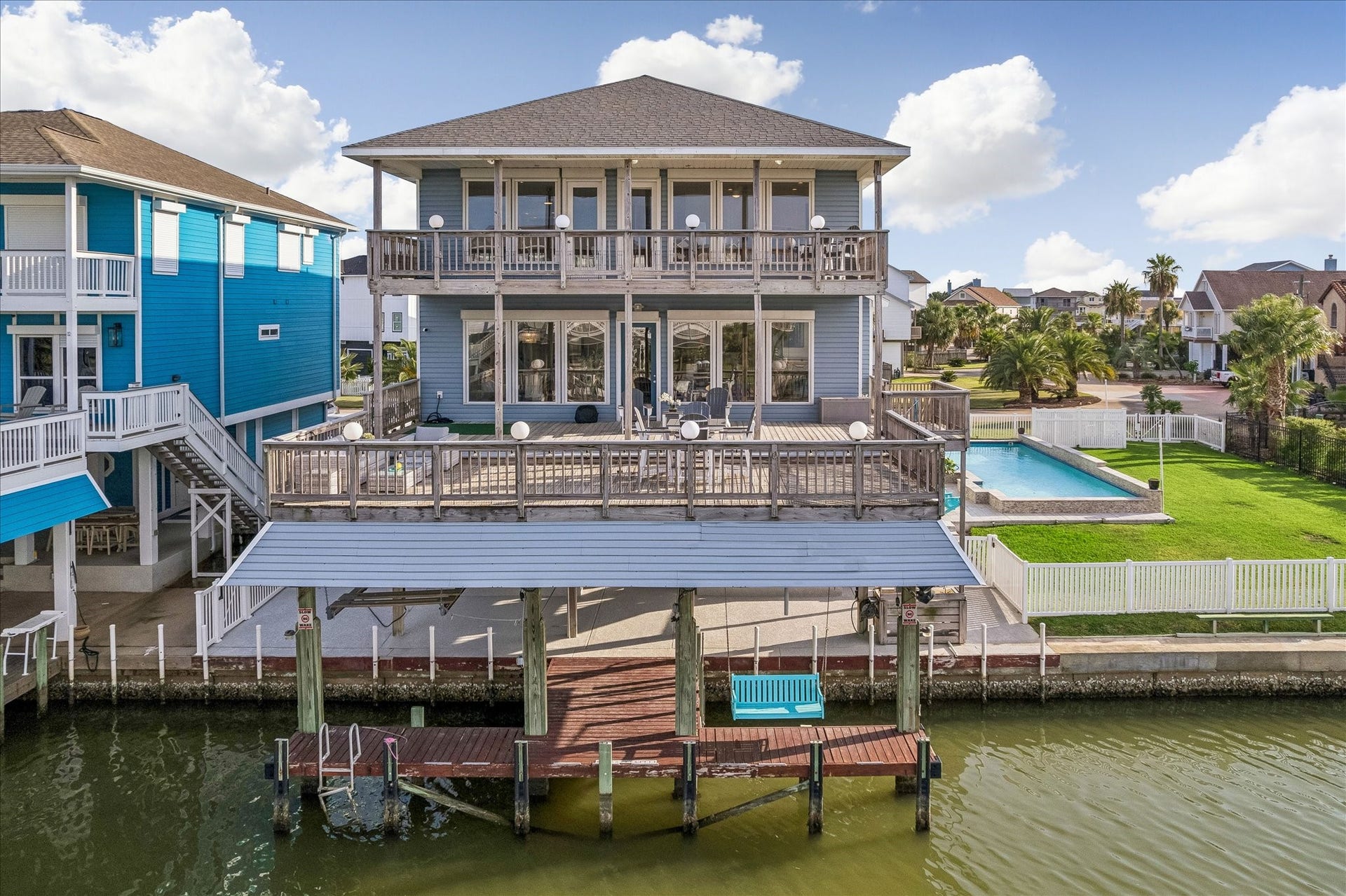 426 Sunset Circle, Tiki Island, TX 77554 Two large decks overlook the Bay, complemented by a double boathouse and private waterfront access. Amazing sunsets, coastal bird watching & excellent fishing happen right here!!