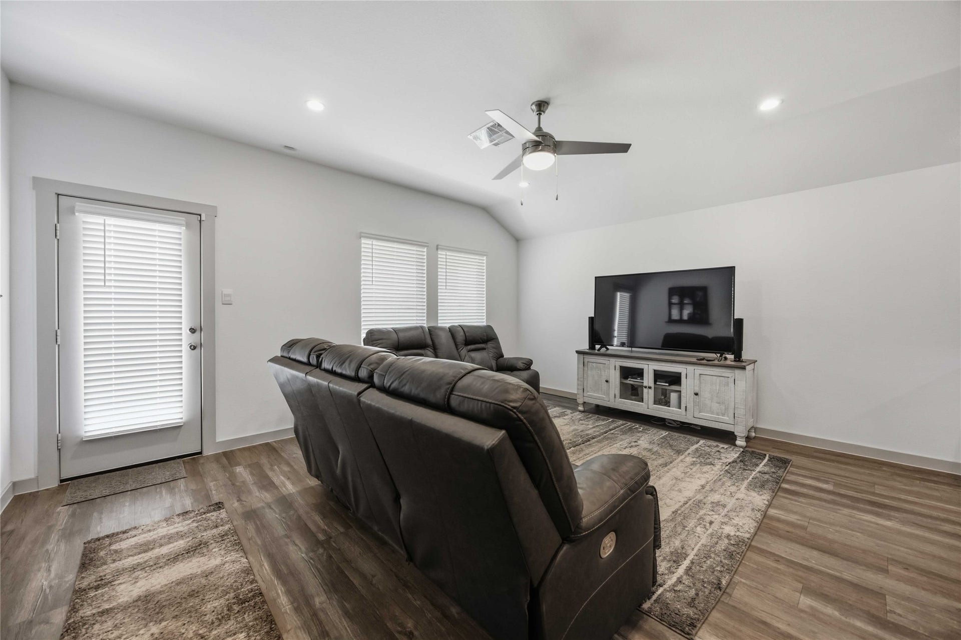 1029 Great Barracuda Lane, Alvin, TX 77511 The Harris plan offers life proof vinyl flooring, vaulted ceiling and large windows for natural light.