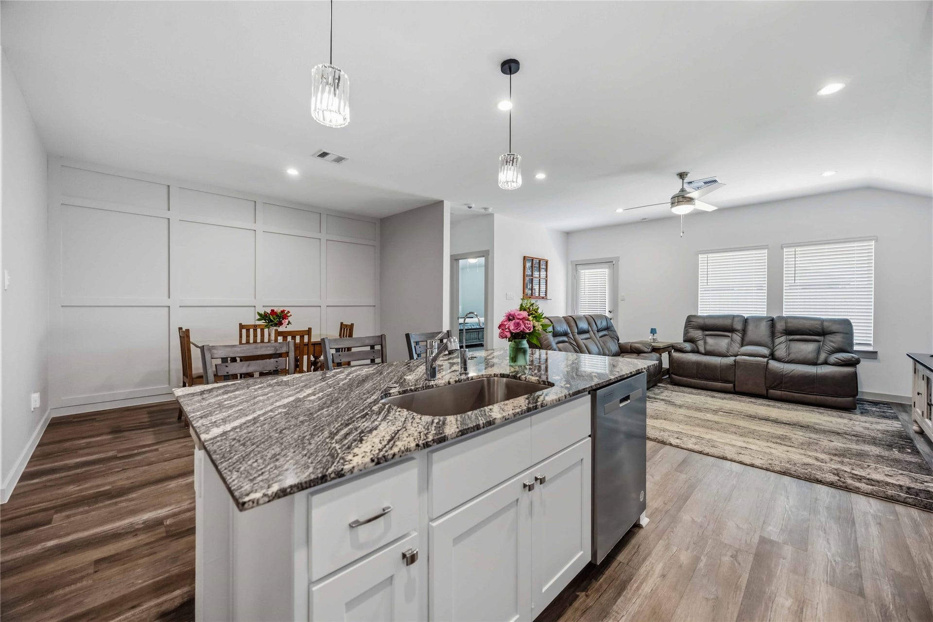 1029 Great Barracuda Lane, Alvin, TX 77511 The dining room offers a custom accent wall and don't forget how amazing the pendant lights are over the bar.