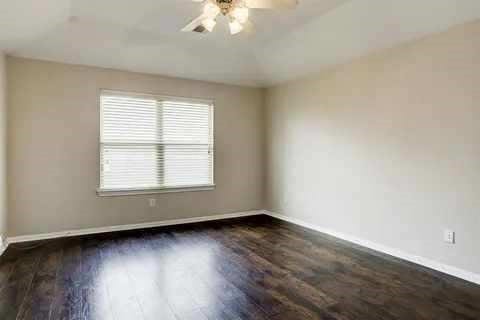 11043 Starling Creek Drive, Richmond, TX 77406 Master Bedroom with Wood-Look Flooring