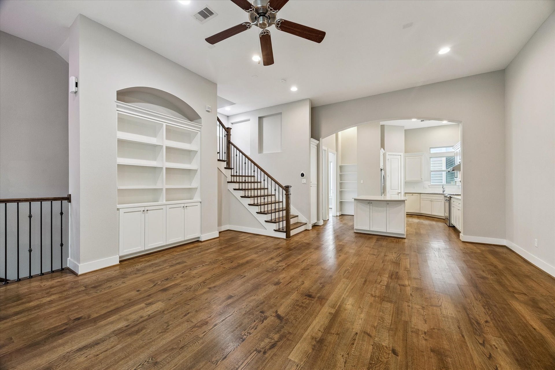 5743 Kiam Street, #F, Houston, TX 77007 Another view of the spacious living room with tall ceilings and beautiful wood floors.