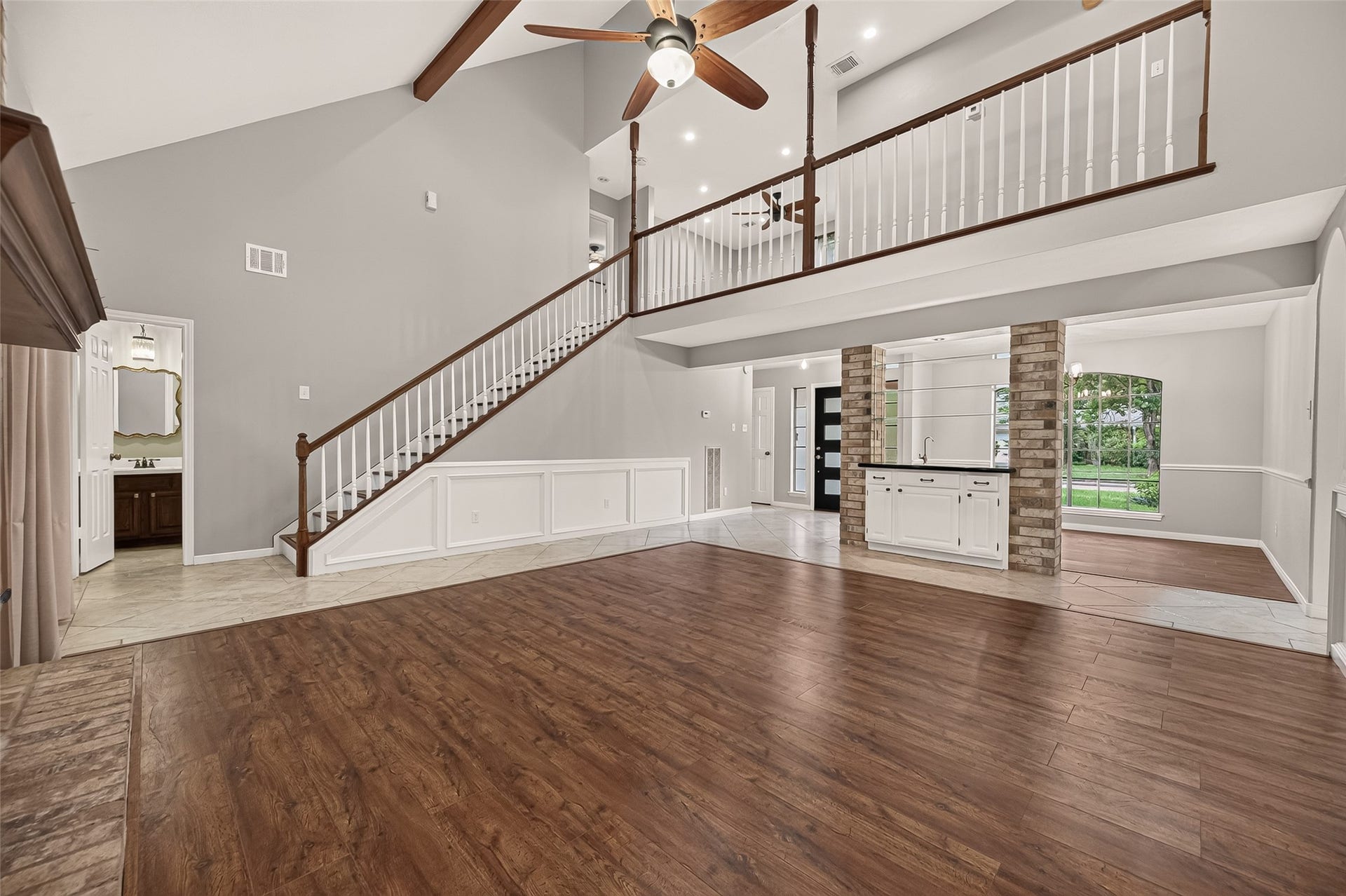 16405 Smith Street, Jersey Village, TX 77040 The open floorplan creates an easy flow between the home's main living spaces while still allowing each room to maintain its own purpose. Conveniently located at the base of the staircase, the first-floor powder room is easily accessible for family and guests without being tucked away through the utility room or off the kitchena thoughtful detail you'll appreciate when entertaining. Just beyond the base of the stairs, a doorway leads to the expansive game room, where even more flexible living space awaits.