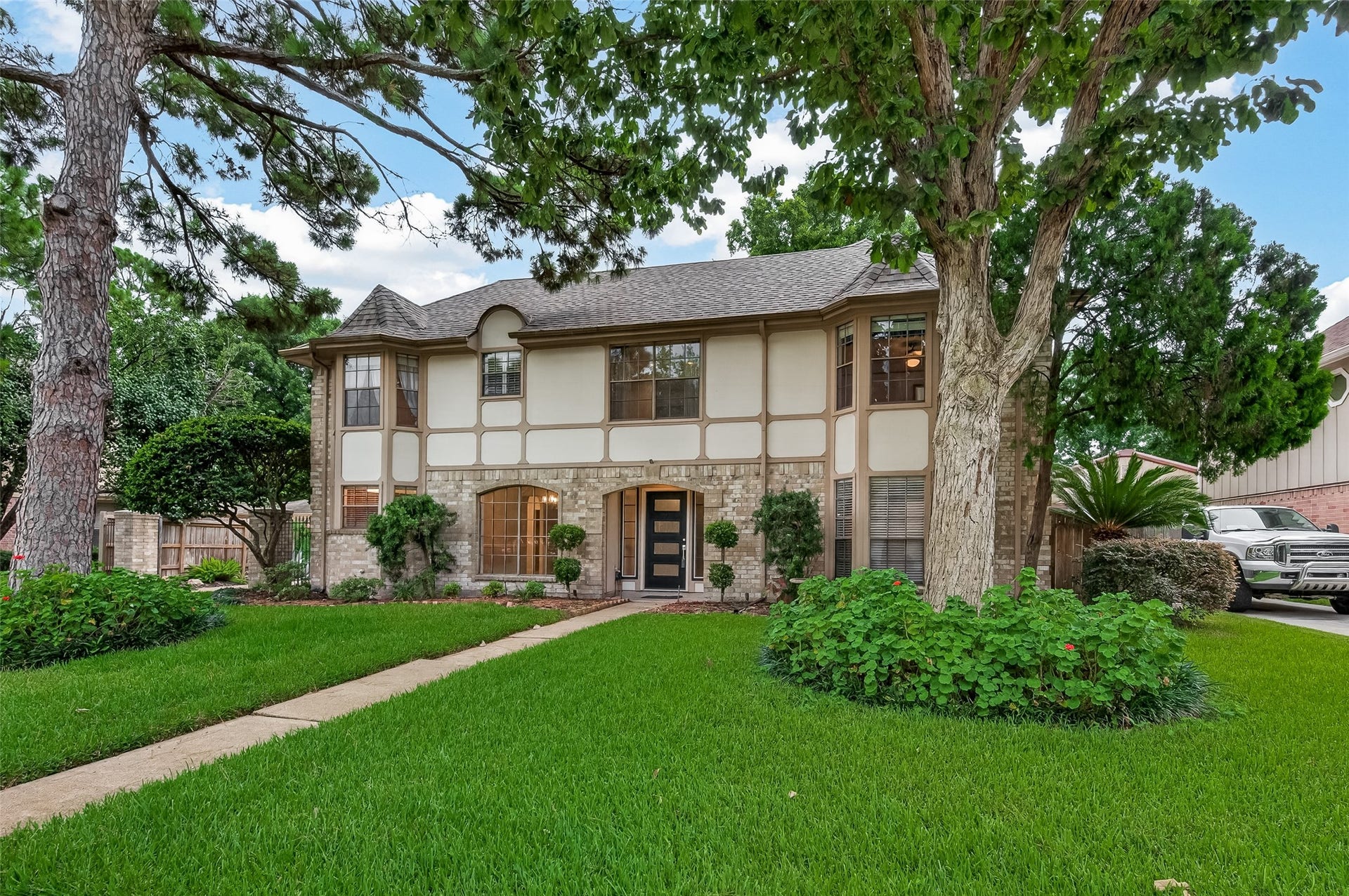 16405 Smith Street, Jersey Village, TX 77040 Beautifully landscaped and enhanced by a full sprinkler system, this distinguished residence offers curb appeal that's been thoughtfully maintained over the years. It reflects the pride of longtime owners who loved both the home and the community so much that, when it came time to downsize, they chose to remain right here in Jersey Village. Beyond the inviting exterior lies a home filled with flexible living spaces designed to grow and adapt through every season of life.