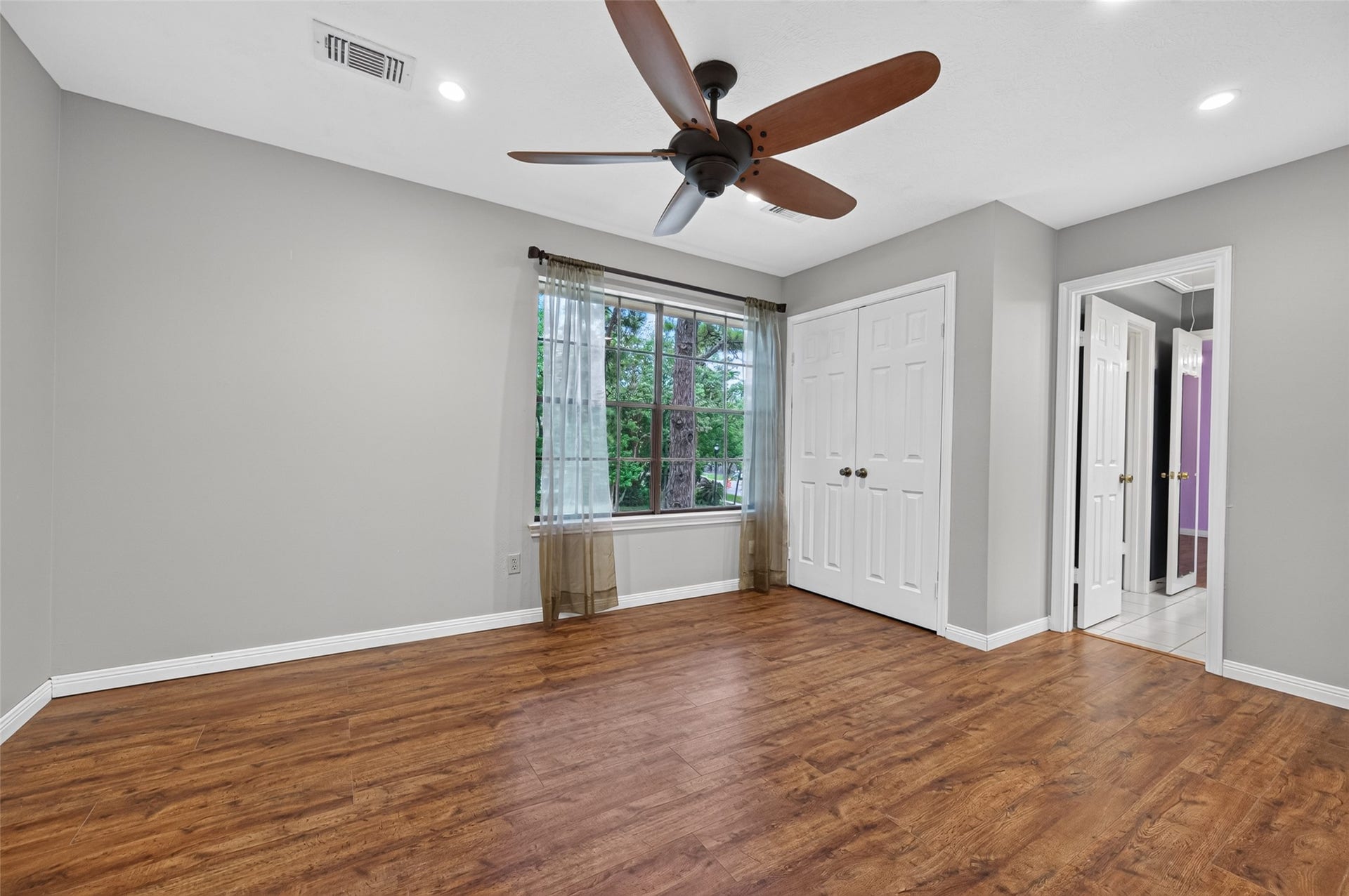 16405 Smith Street, Jersey Village, TX 77040 Need a 4th bedroom? This flexible space offers exciting potential and could be enclosed to create a private bedroom. A large front-facing window fills the room with natural light, while a ceiling fan, recessed lighting, double-door closet, and direct access to the adjoining full bath provide many of the features buyers expect in a traditional bedroom. Or leave it open and enjoy the additional space as it isthe possibilities are yours!