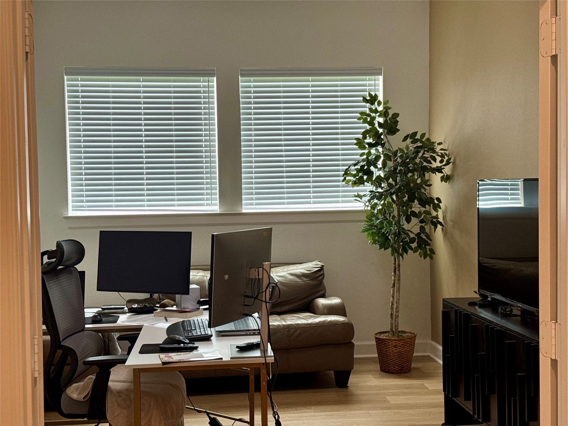 9911 Deep Water Drive, Missouri City, TX 77459 Bright home office space featuring large windows with blinds, a comfortable seating area, and ample room for workstations.