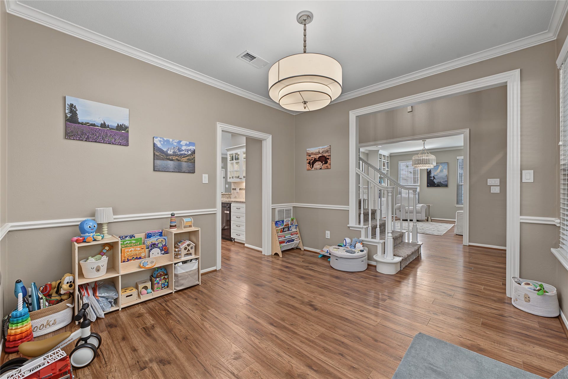 5 Otter Pond Place, The Woodlands, TX 77381 Like many other rooms in this home, the formal dining area offers updated lighting.