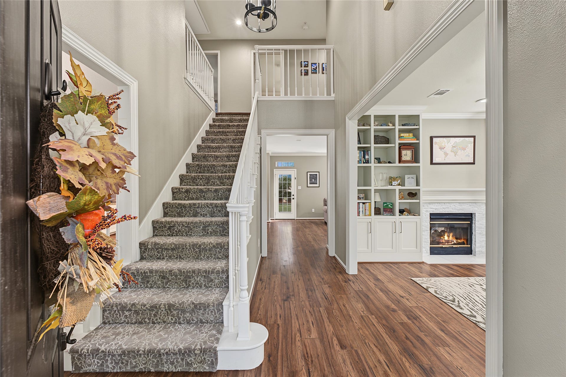 5 Otter Pond Place, The Woodlands, TX 77381 The bottom floor features two distinct living areas, a formal dining area, and kitchen.