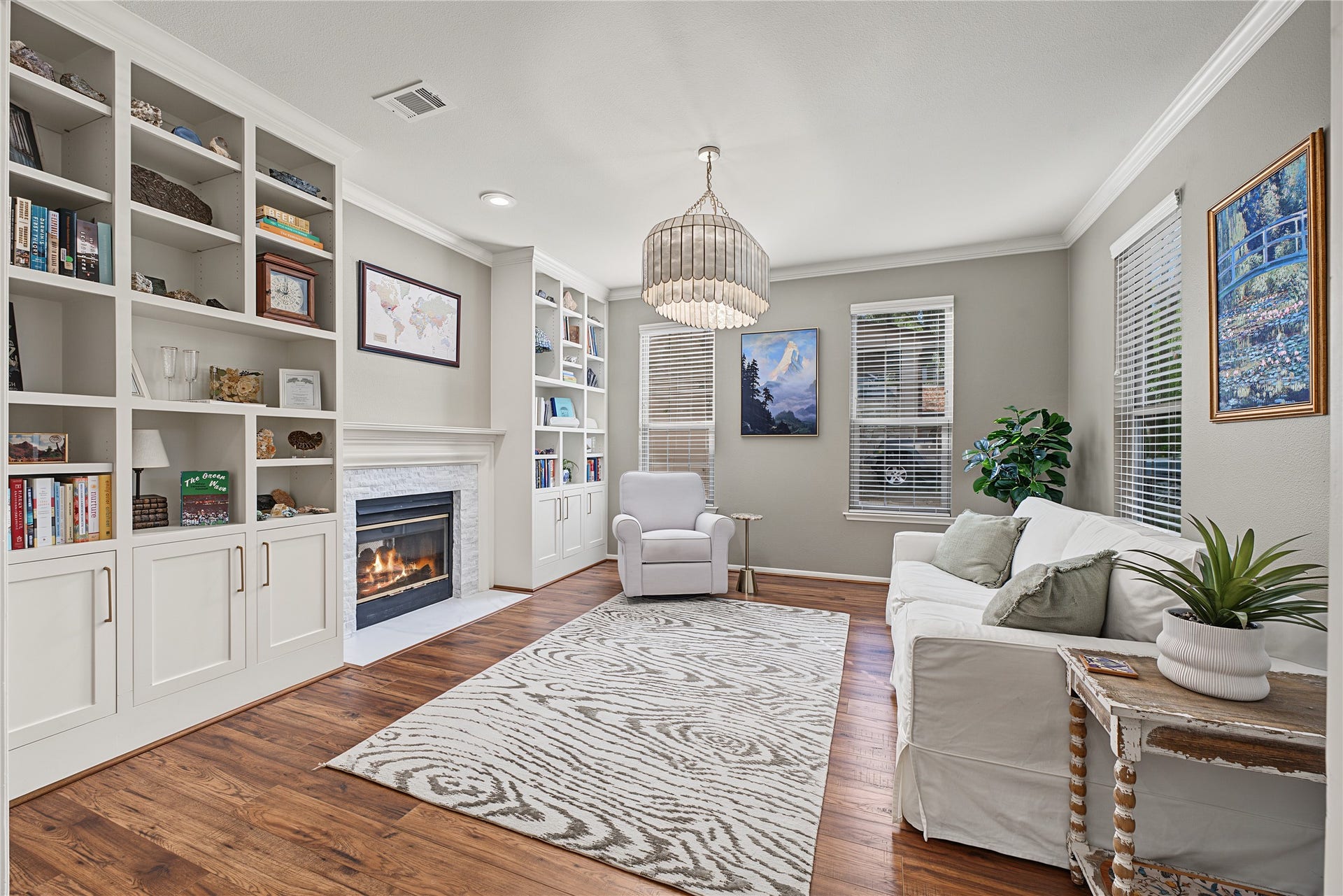 5 Otter Pond Place, The Woodlands, TX 77381 Updated flooring, lighting, and custom stacked stone fireplace surround.