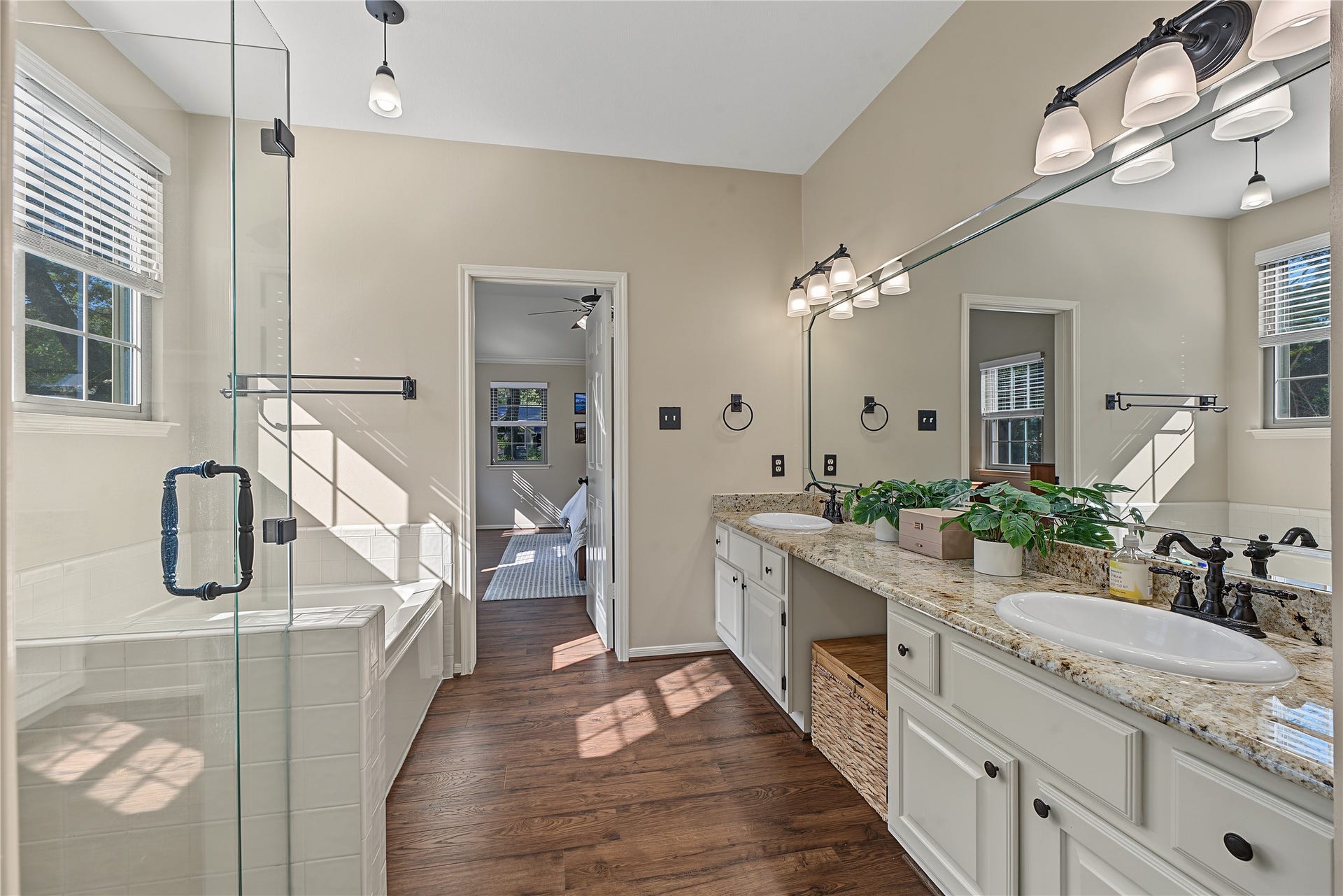 5 Otter Pond Place, The Woodlands, TX 77381 Double vanity featuring updated hardware and light fixtures.