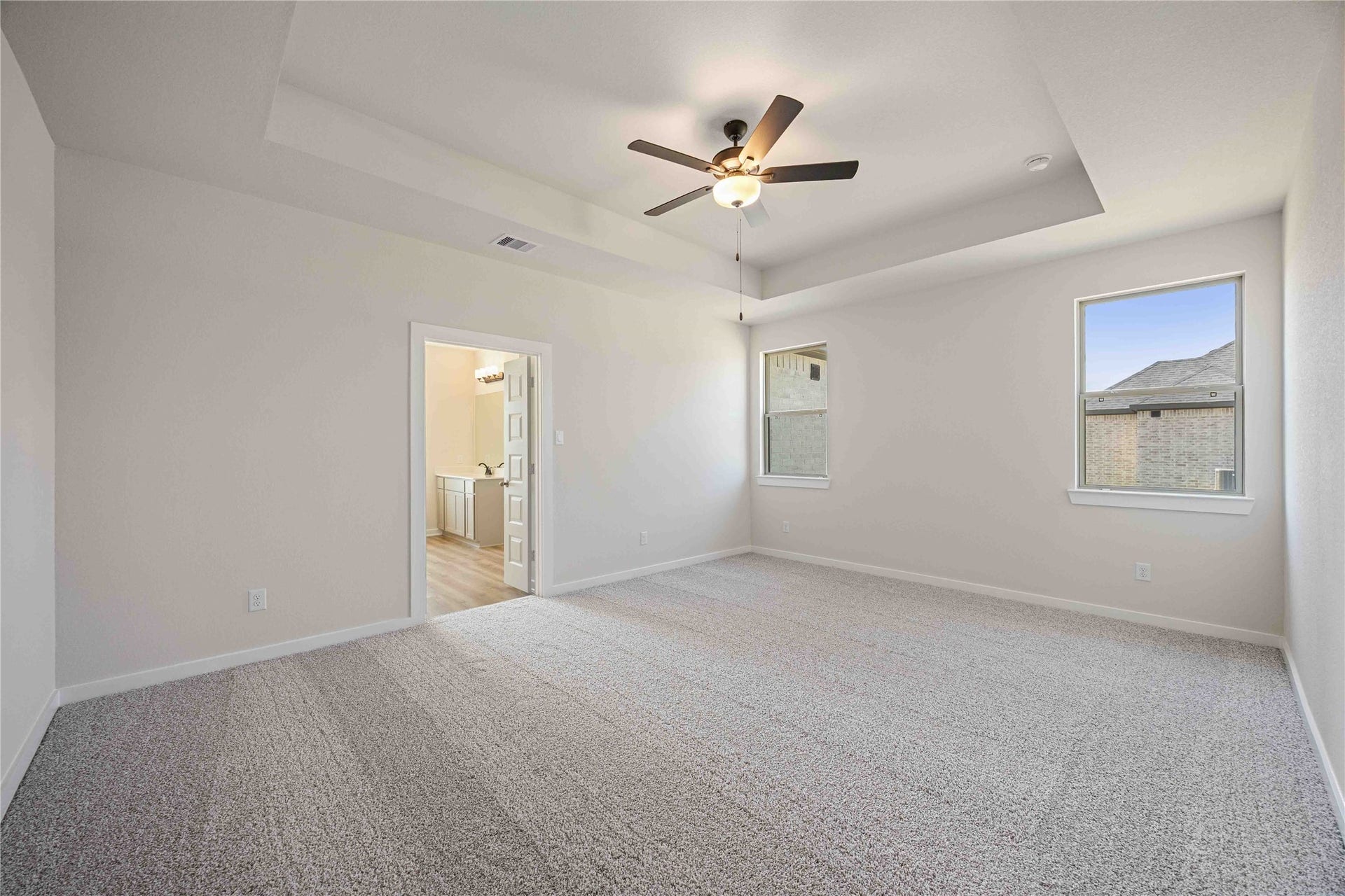 The luxurious owner's retreat is a private oasis with a spa-inspired bath and an extended walk-in closet.