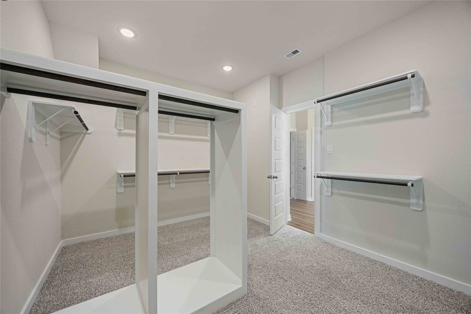 The luxurious owner's retreat is a private oasis with a spa-inspired bath and an extended walk-in closet.