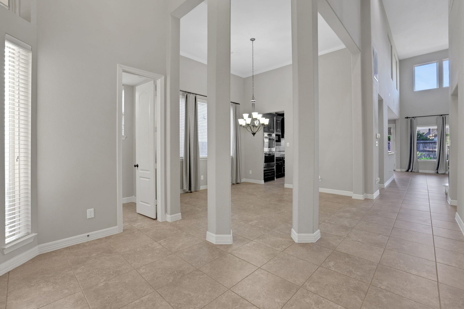 As you step into this gorgeous Trendmaker home you are greeted. by tile flooring and architectural details that make this home stand apart