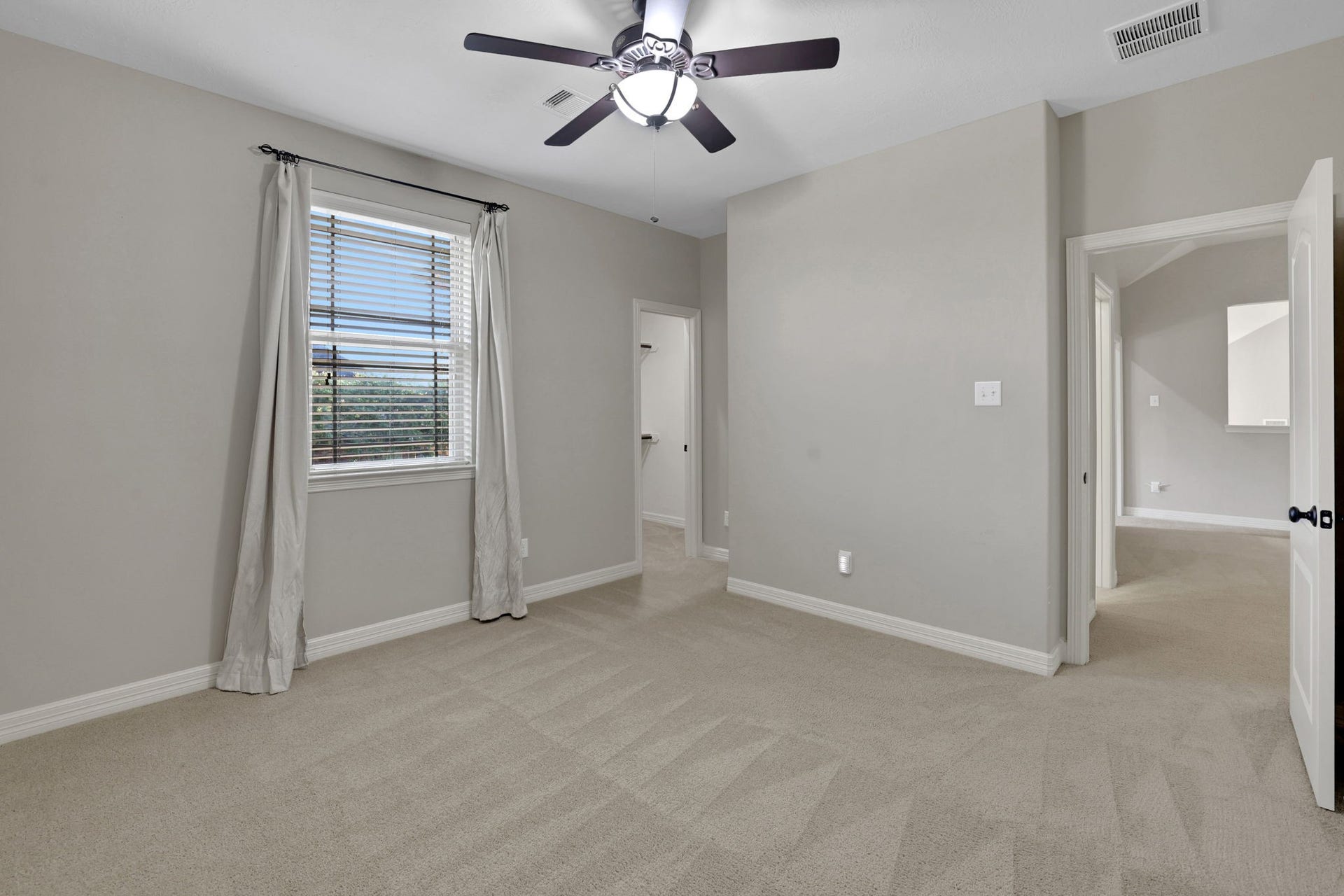 Another secondary bedroom up features an oversized walk-in closet