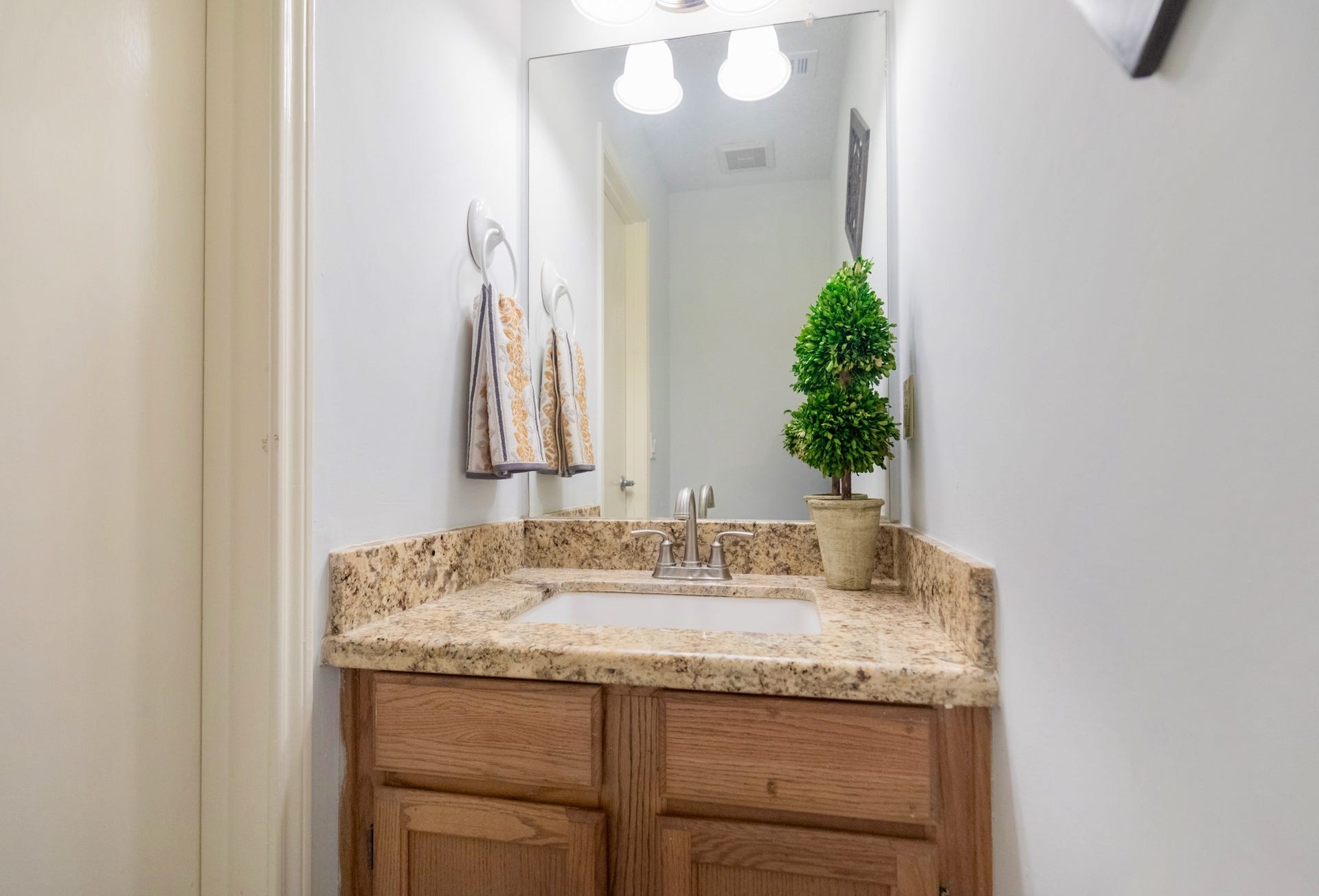 3007 Rimrock Drive, Missouri City, TX 77459 JUST OFF THE LIVING AREA, THE HALF BATH HAS BEEN APPOINTED WITH HIGH-GRADE GRANITE COUNTERTOPS AND ELEGANT PENDANT LIGHTING!!!