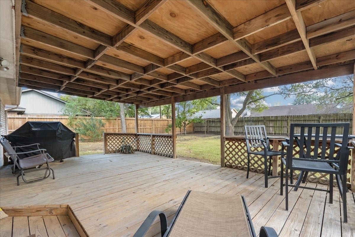 214 Oakwood Street, League City, TX 77573 Spacious covered deck offers an inviting setting for outdoor dining, entertaining, or relaxing.