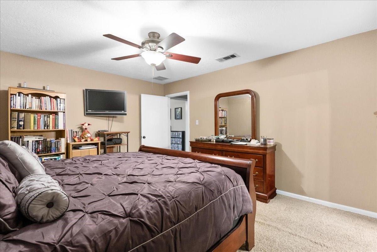 214 Oakwood Street, League City, TX 77573 Additional primary bedroom view showing the room's size and furniture arrangement.