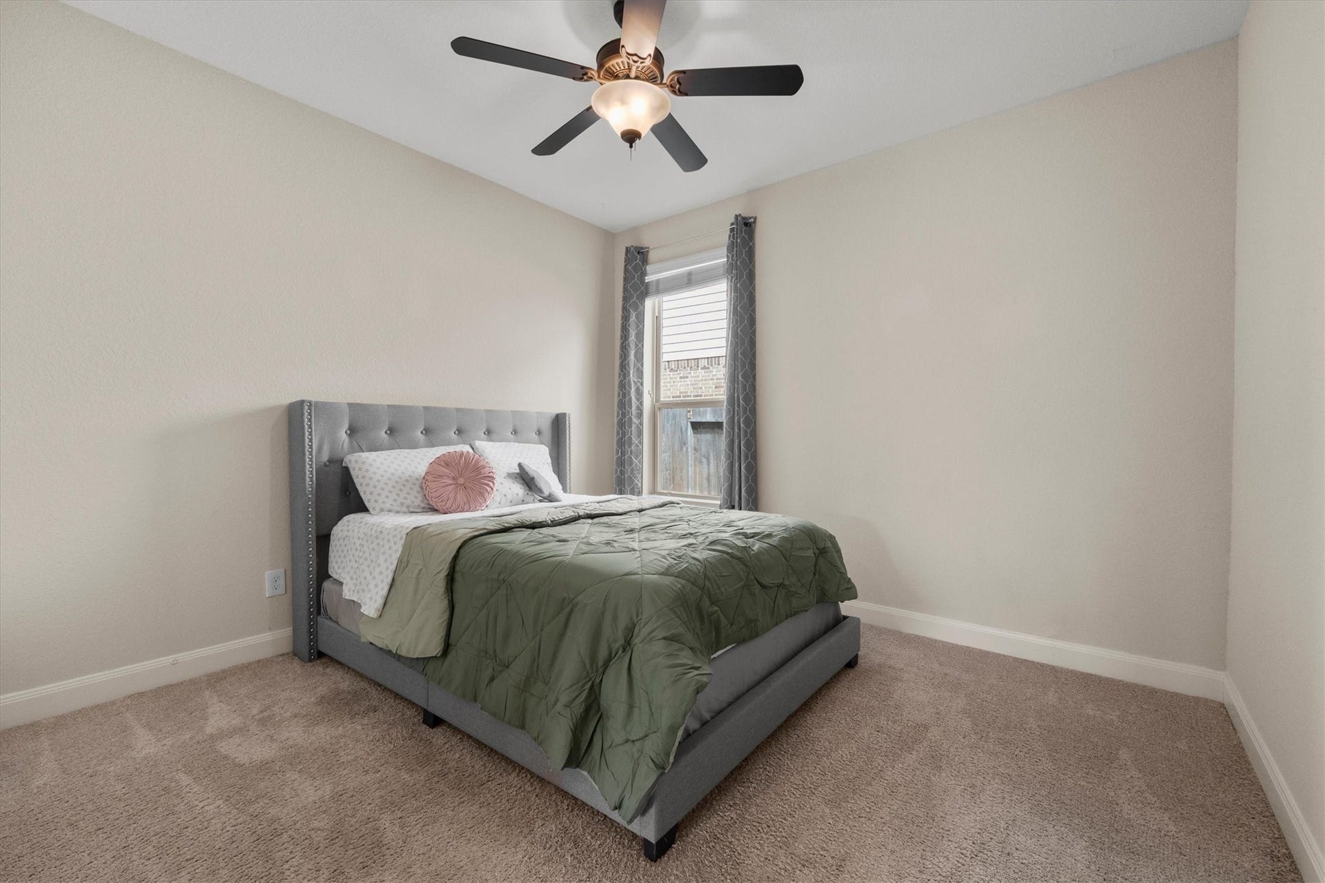 17903 Fernwood Bend Drive, Tomball, TX 77377 Bedroom #3 is spacious and features plush carpeting with lighted ceiling fan.
