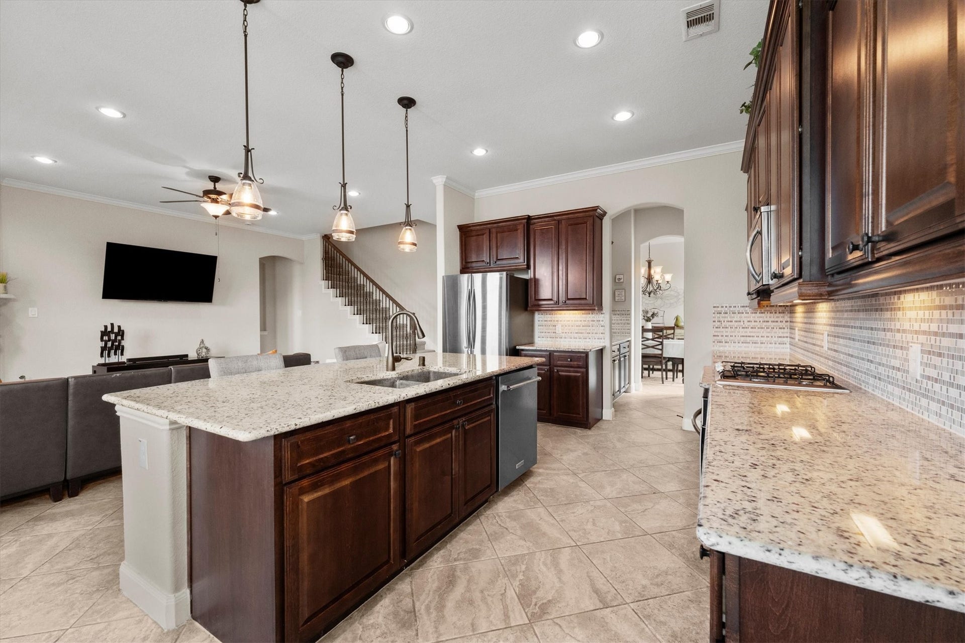 17903 Fernwood Bend Drive, Tomball, TX 77377 Sightlines from this angle lead to the Butler's Pantry, Dining Room, Primary Suite just beyond the archway, and the stairs leading to the second level. We'll take you there shortly.
