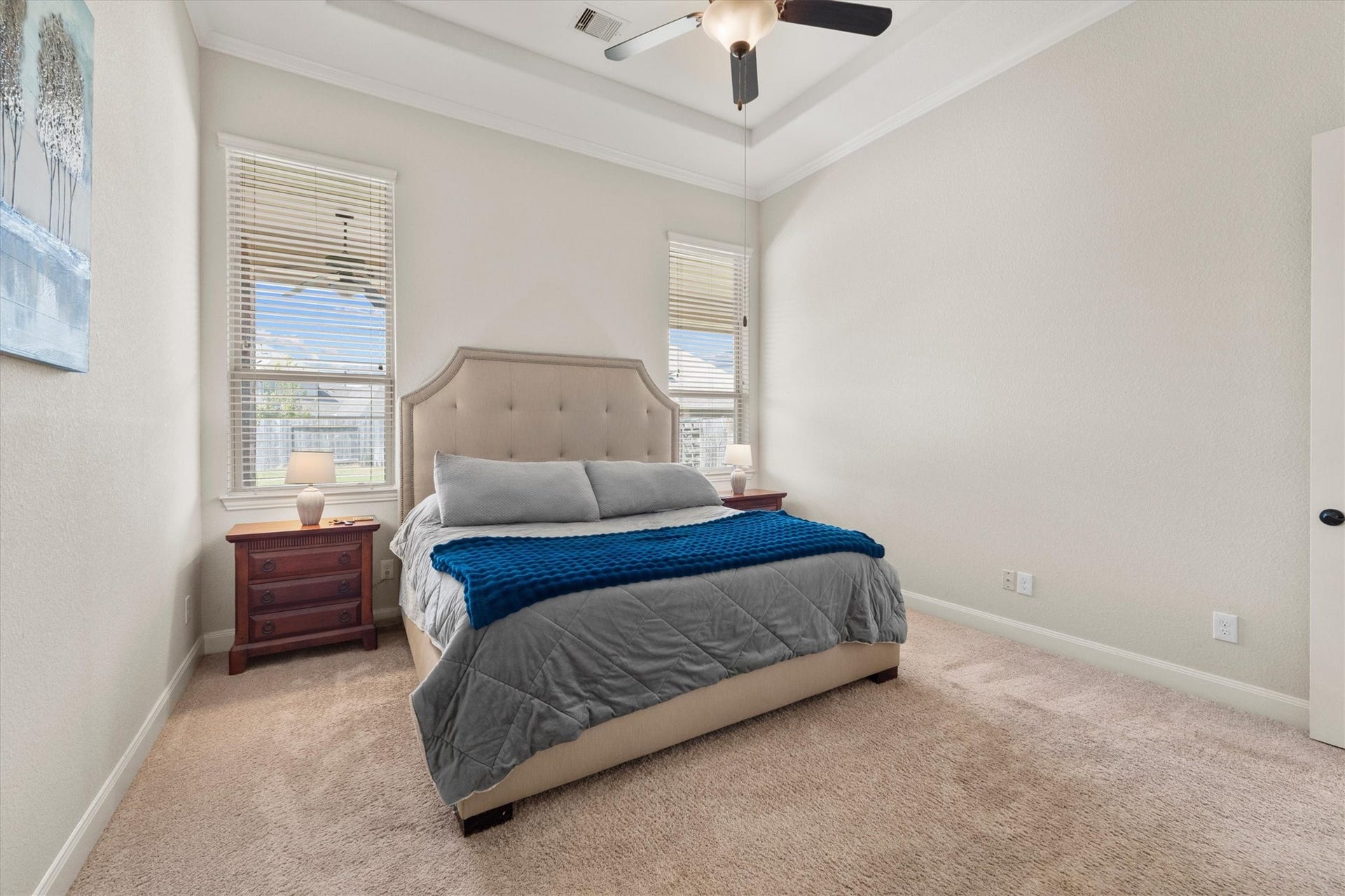 17903 Fernwood Bend Drive, Tomball, TX 77377 A high trey ceiling trimmed in crown molding create a spacious feel to the already large Primary Bedroom.