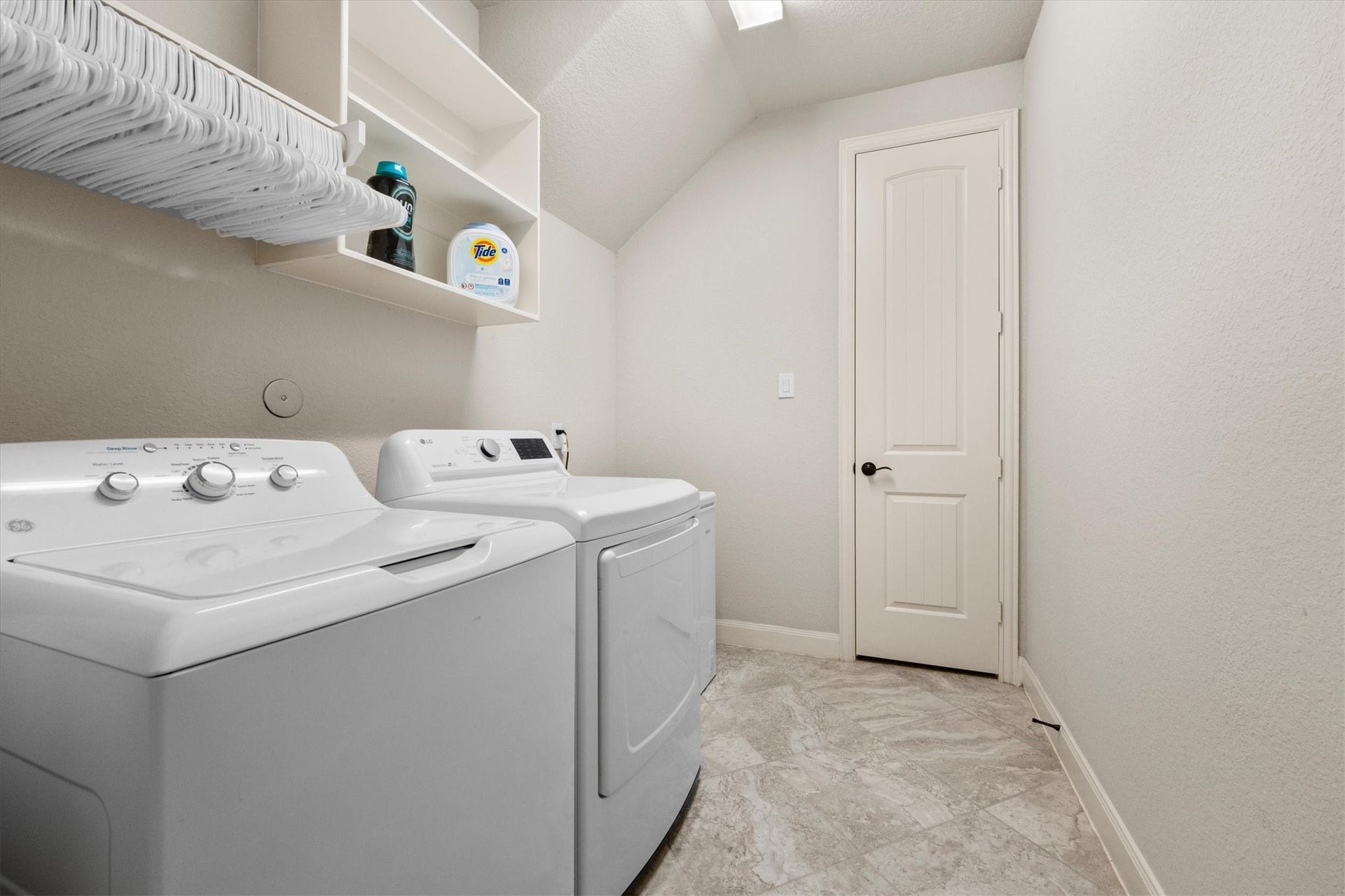 17903 Fernwood Bend Drive, Tomball, TX 77377 This Laundry Room is extra spacious with room for a second refrigerator or small freezer. A utility closet easily accommodates extra laundry supplies.