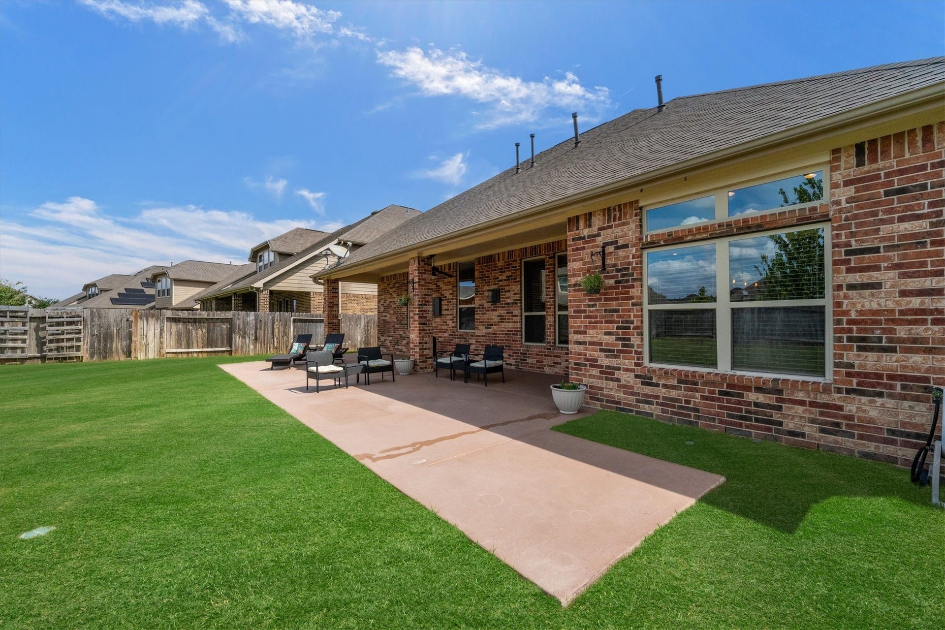 17903 Fernwood Bend Drive, Tomball, TX 77377 The extended concete patio makes this a great candidate for an outdoor kitchen.