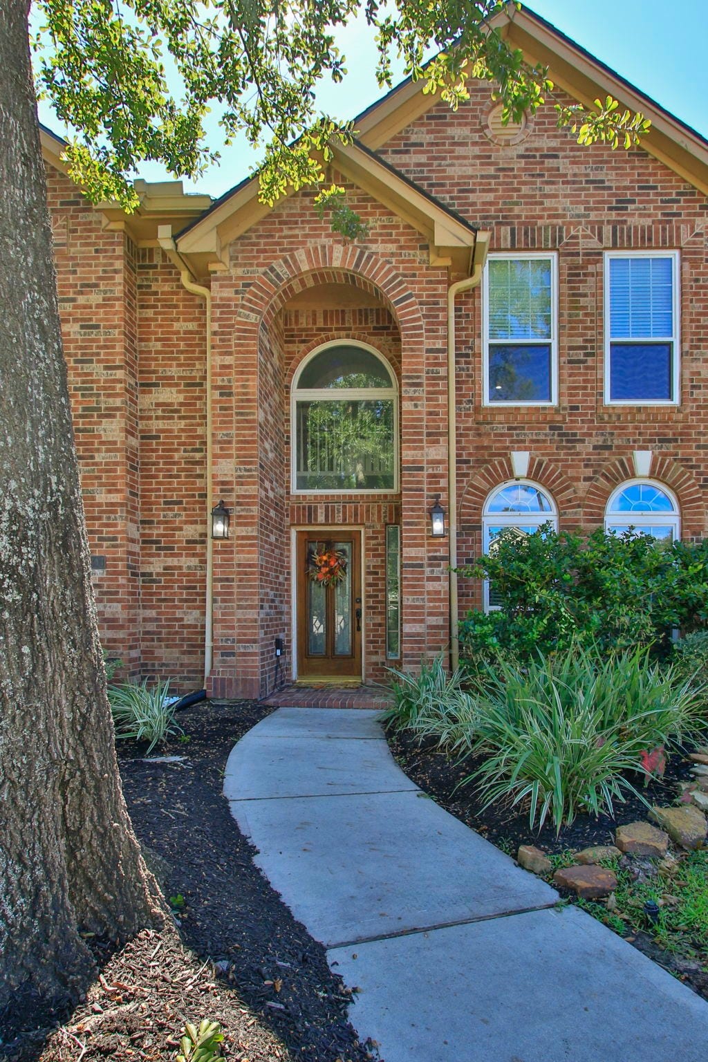 14303 Spyglen Lane, Cypress, TX 77429 An elegant archway welcomes your friends and family.