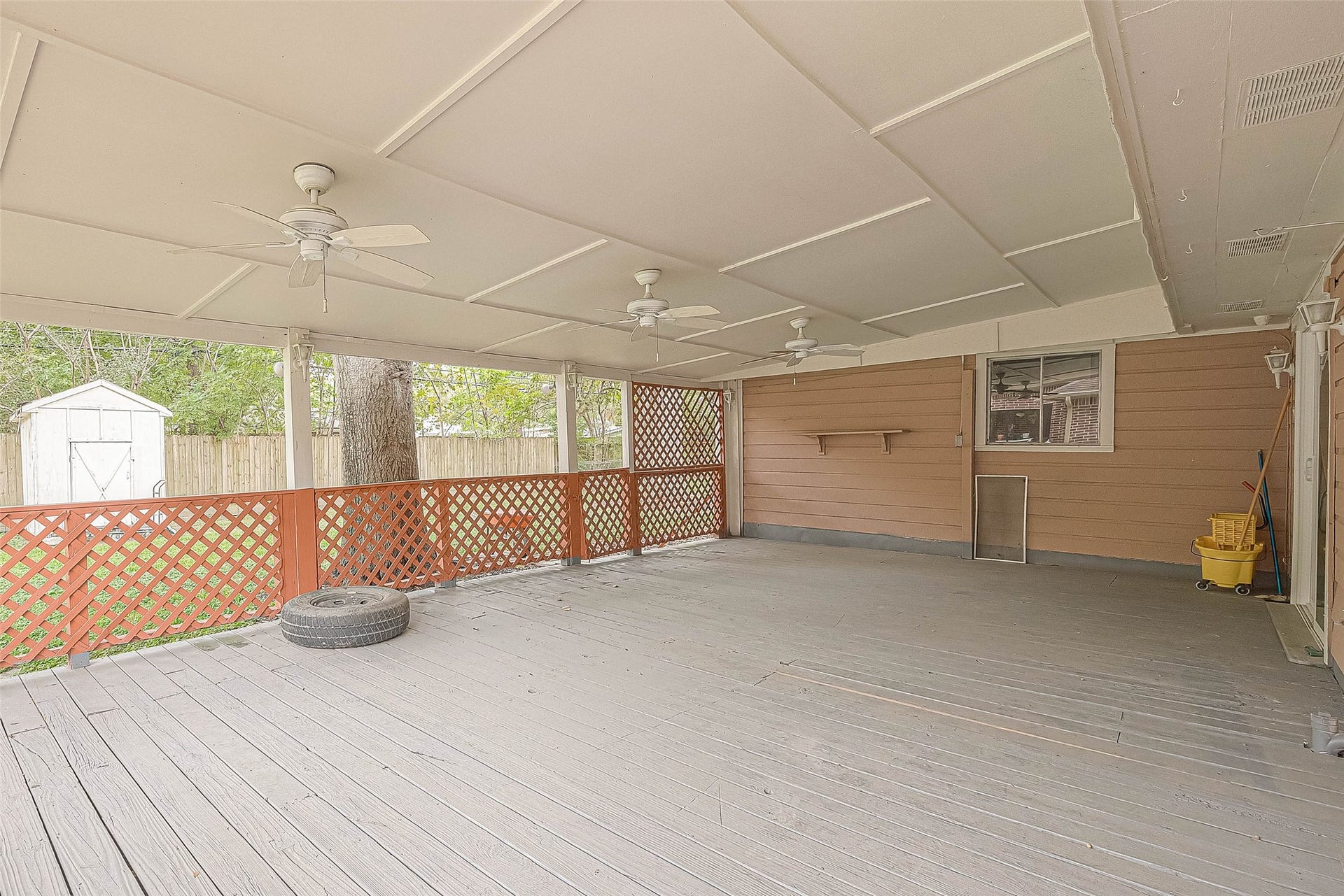 7022 Triola Lane, Houston, TX 77074 Look at this huge covered deck already set so you watch your favorite sports and entertain guest.