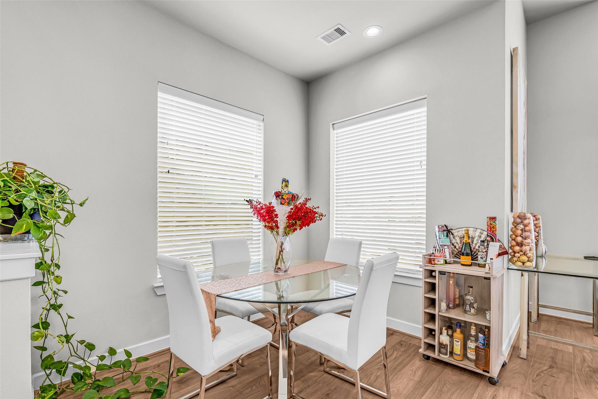 3313 Hutchins Street, Houston, TX 77004 Dining area positioned in a bright corner, illuminated by a pair of windows that bring in natural light and create a pleasant space for meals.