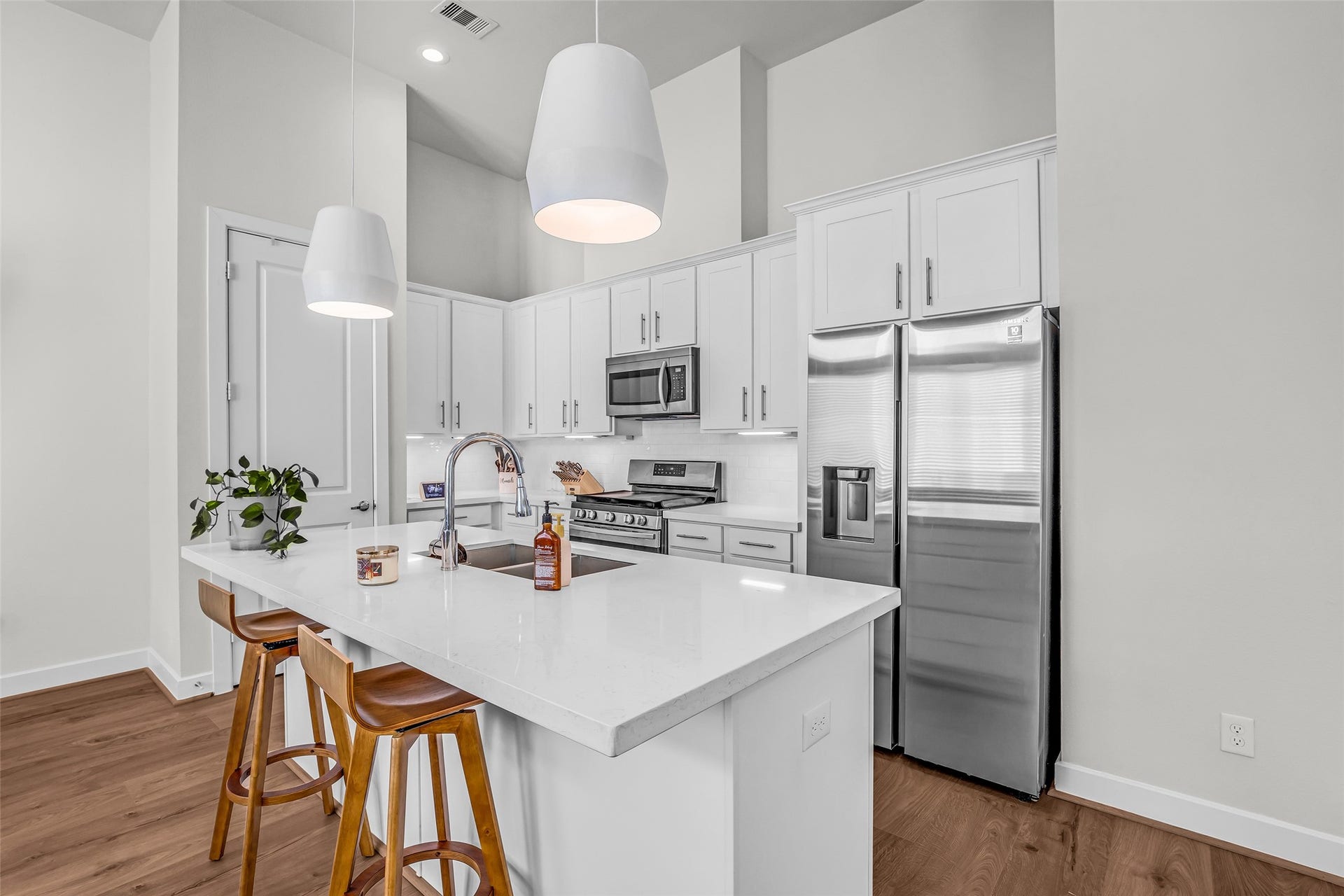 3313 Hutchins Street, Houston, TX 77004 It includes an island with a built-in sink, providing additional workspace for meal preparation and a convenient breakfast bar for casual dining.
