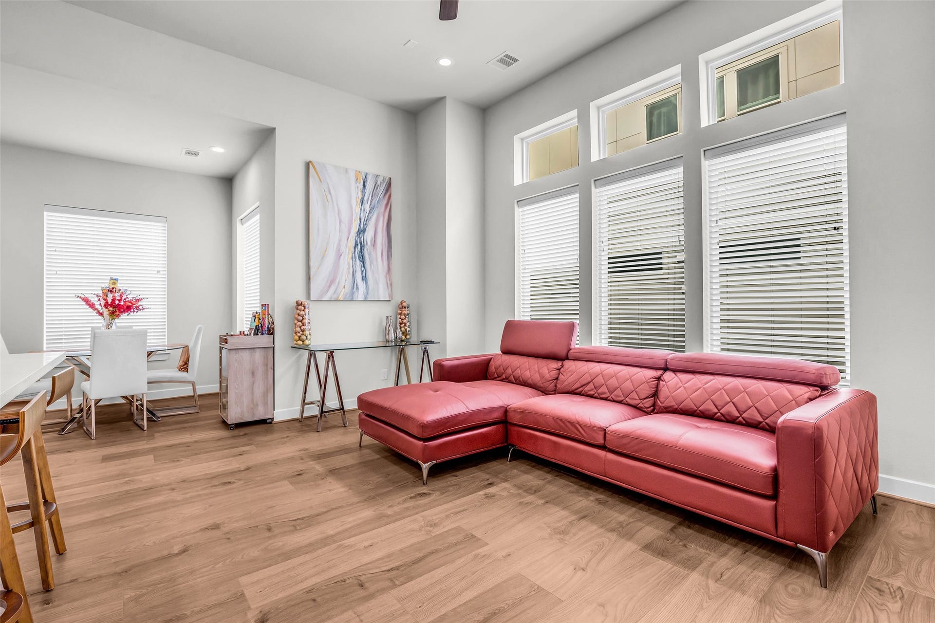 3313 Hutchins Street, Houston, TX 77004 Living room featuring warm wood flooring that continues seamlessly into the adjacent living spaces, creating a cohesive and inviting main gathering area.