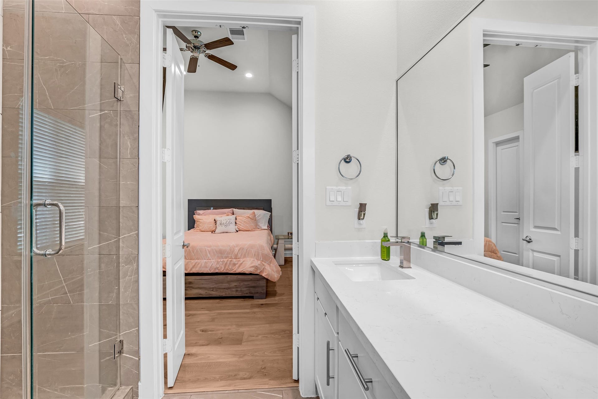 3313 Hutchins Street, Houston, TX 77004 Primary bathroom featuring a separate tub and shower, a large mirror, and double sinks, designed for convenience and everyday functionality.